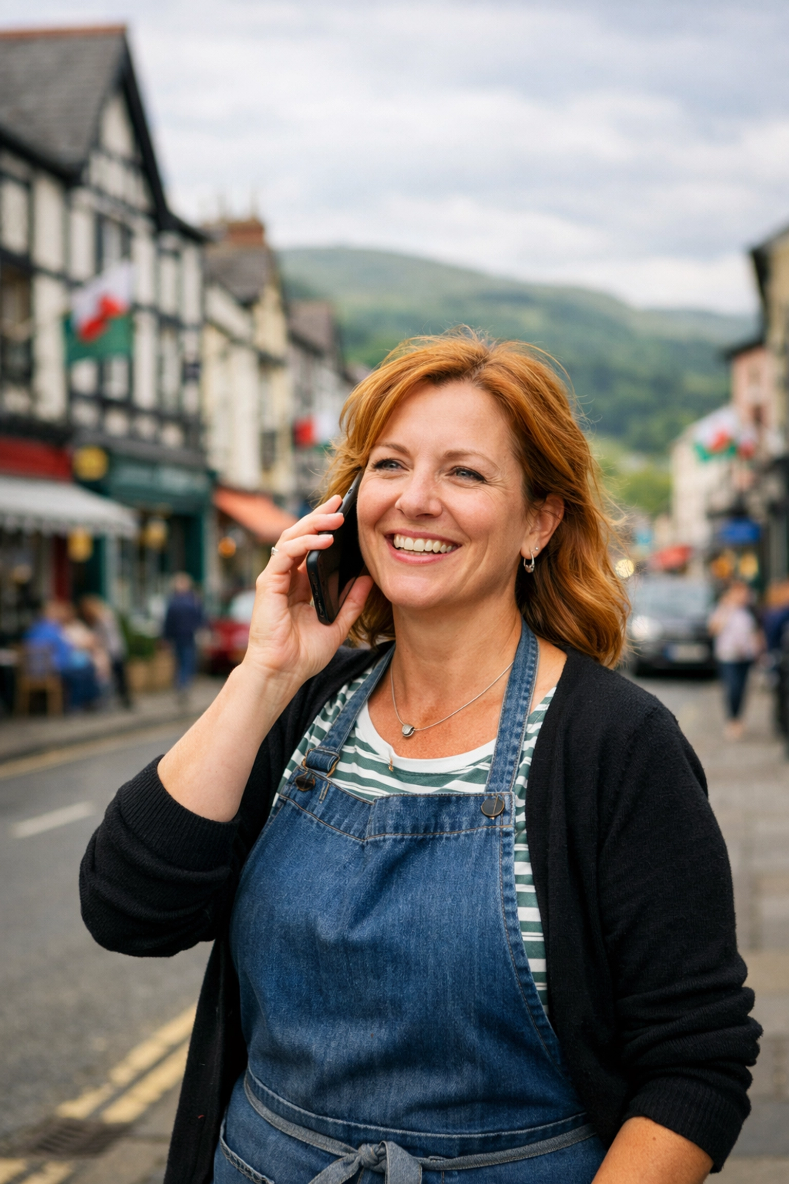 Successful North Wales business owner receiving a customer call driven by local SEO services.