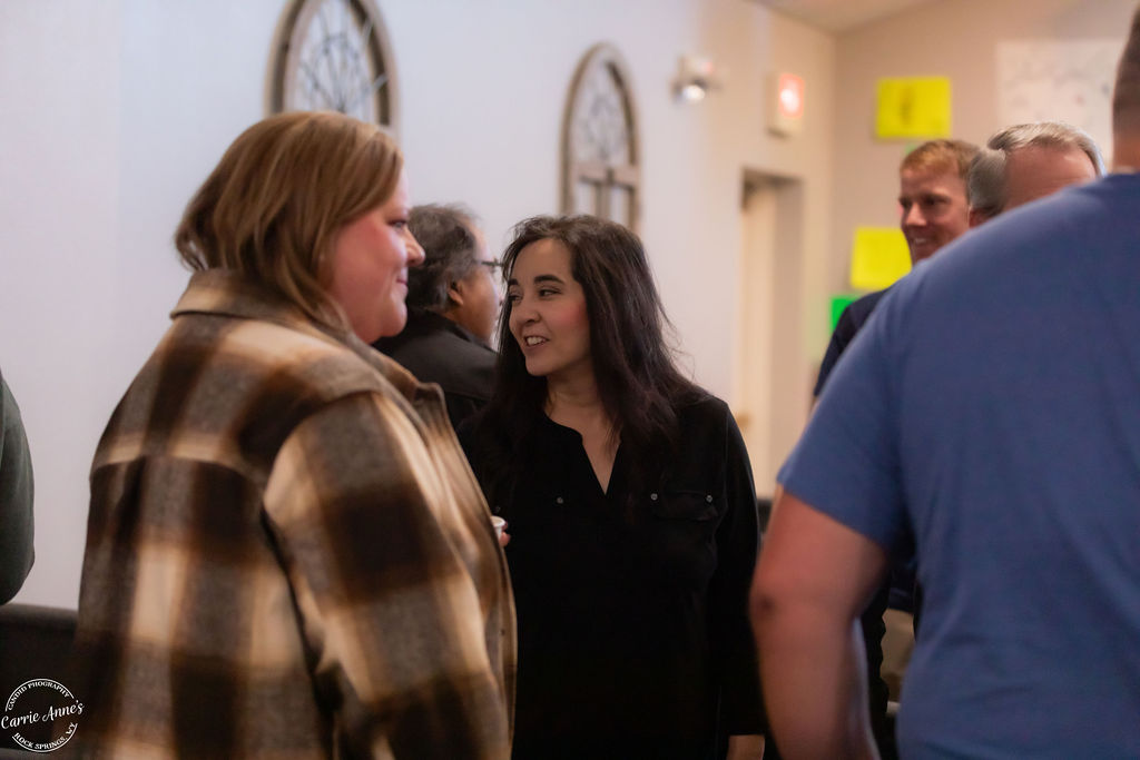 People gathered in church hallway
