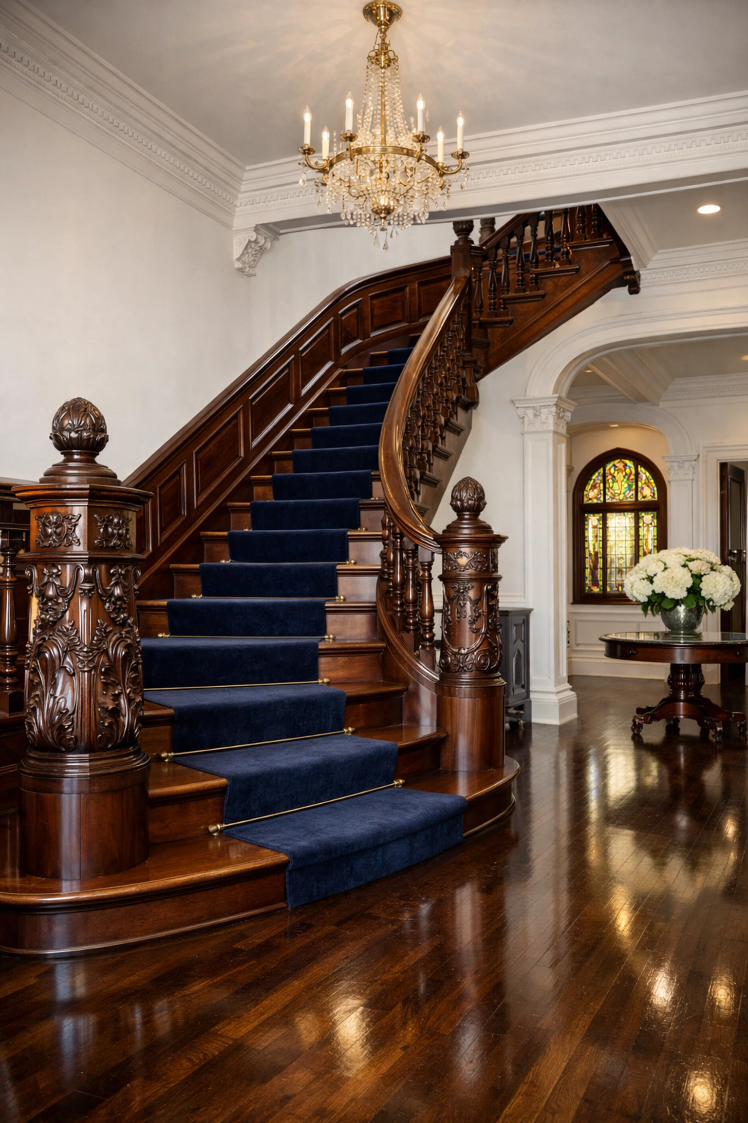 Pristine historic Victorian foyer in Newton MA with polished mahogany floors after luxury house cleaning.