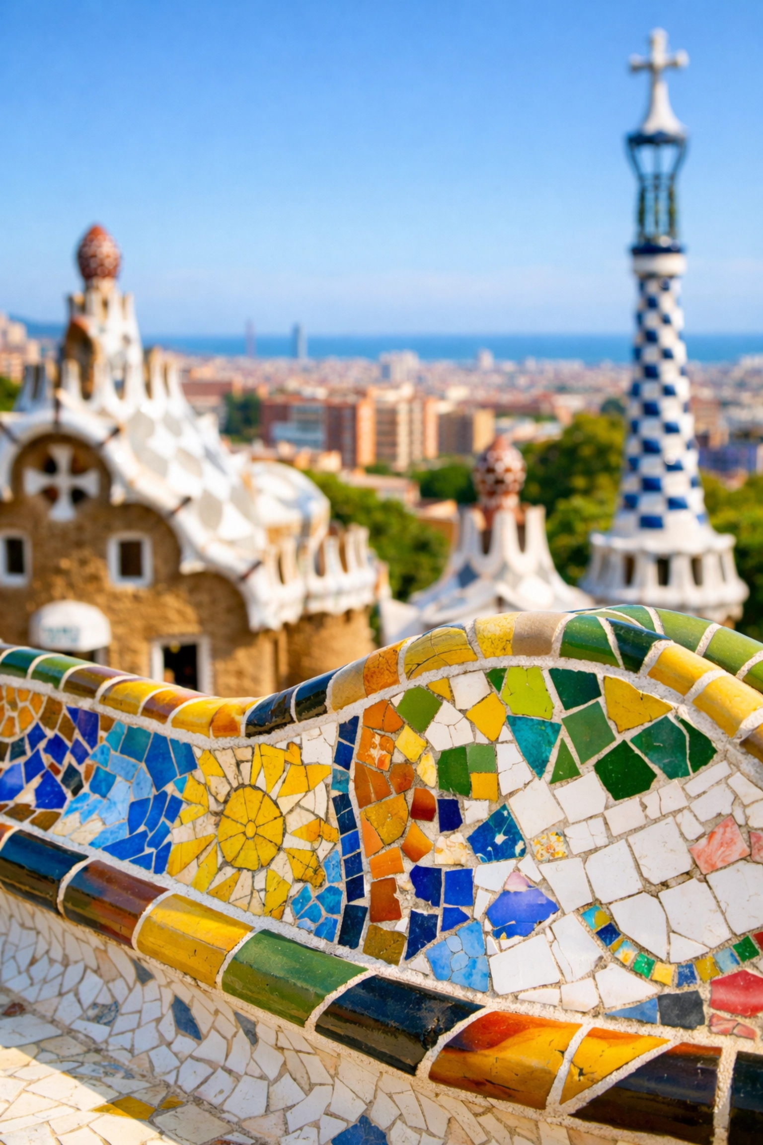 Colorful mosaic benches at Parc Güell in Barcelona, one of the world's most instagrammable places.