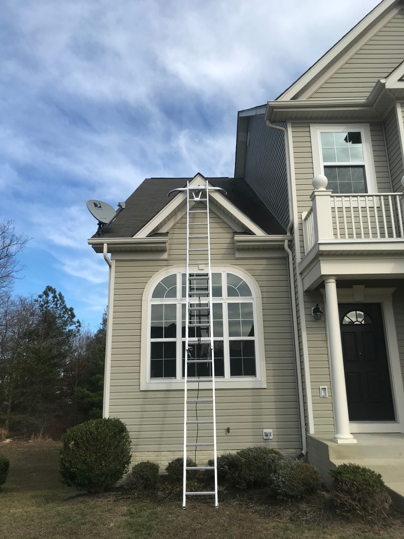 A tall ladder is essential for reaching those second-story gutters to ensure the roofline is perfectly framed