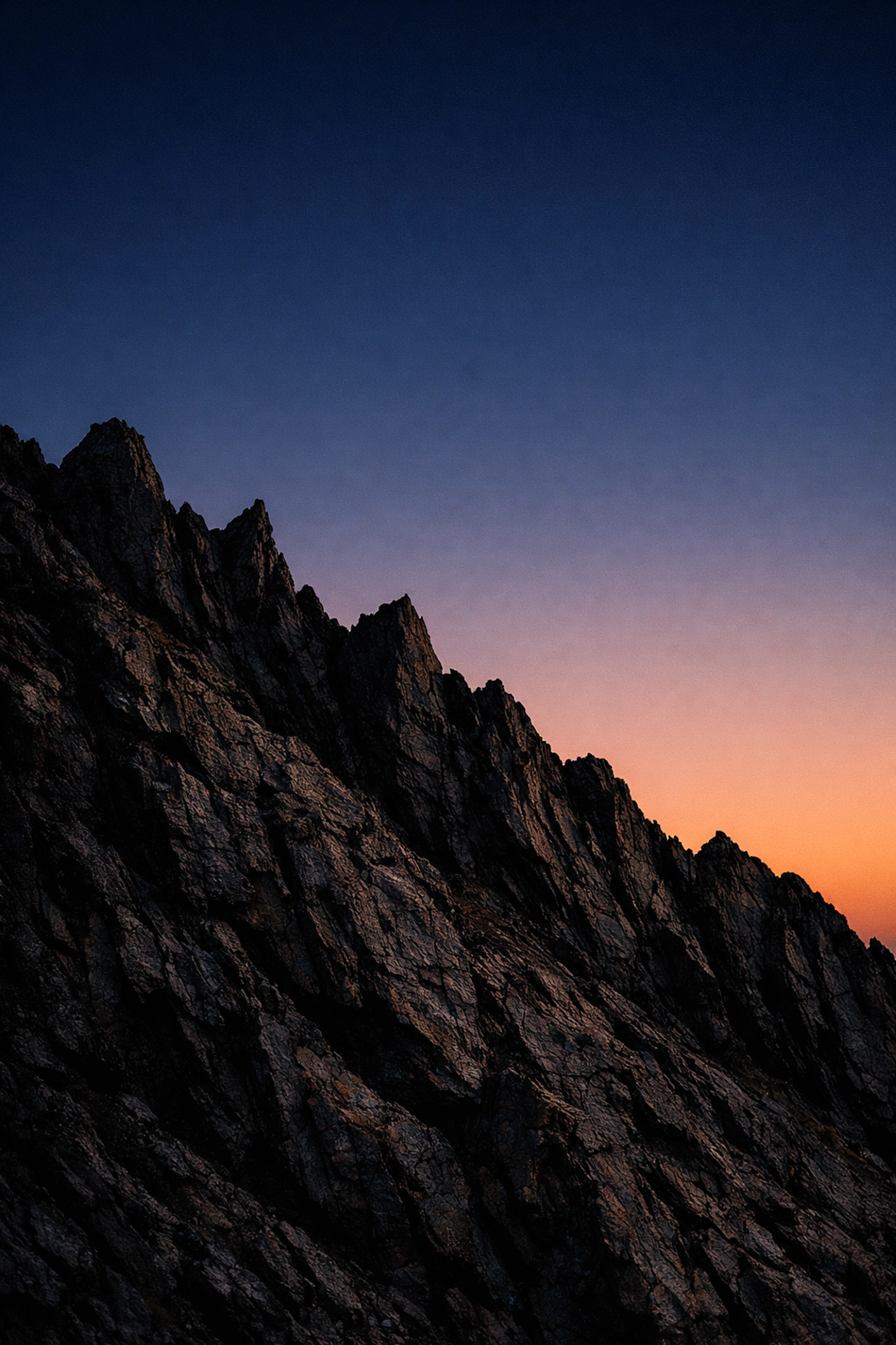 Crisp volcanic ridge against a twilight sky showing clean editing for landscape photography tips.