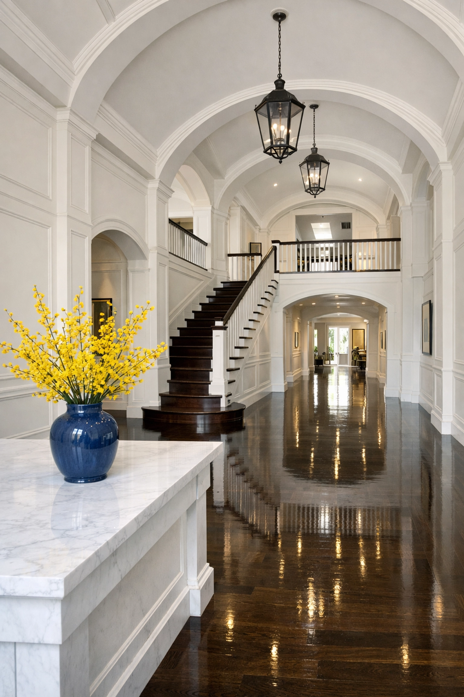 Polished hardwood floors in a luxury Andover foyer, maintained to Addison Gallery standards with recurring cleaning.