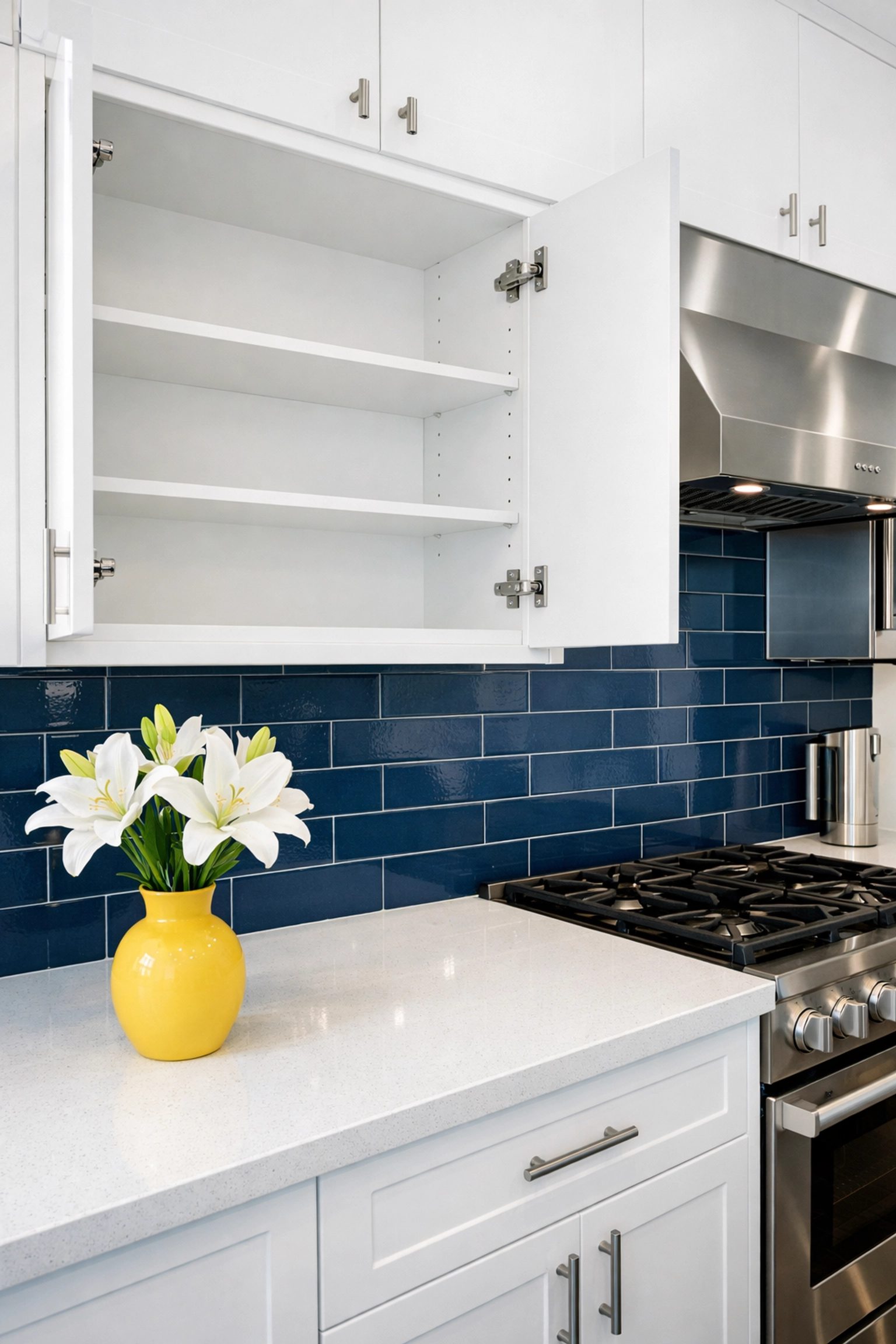 Spotless modern kitchen with deep-cleaned cabinets and quartz counters from a move-in/move-out cleaning Lowell.