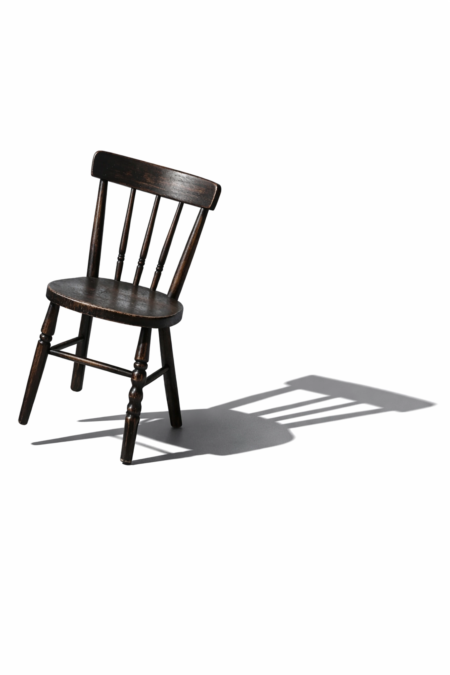 A minimalist wooden chair with a distorted shadow representing atmospheric suspense and psychological dread.