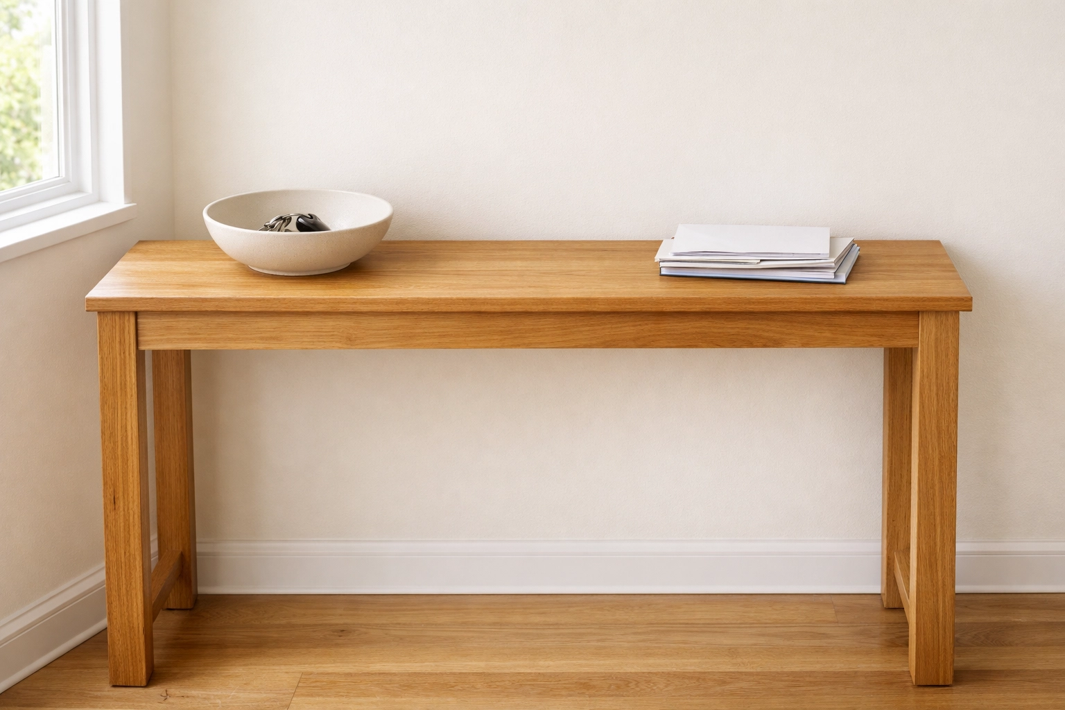 Organized entryway console table with a clear, unobstructed walking path to prevent tripping.