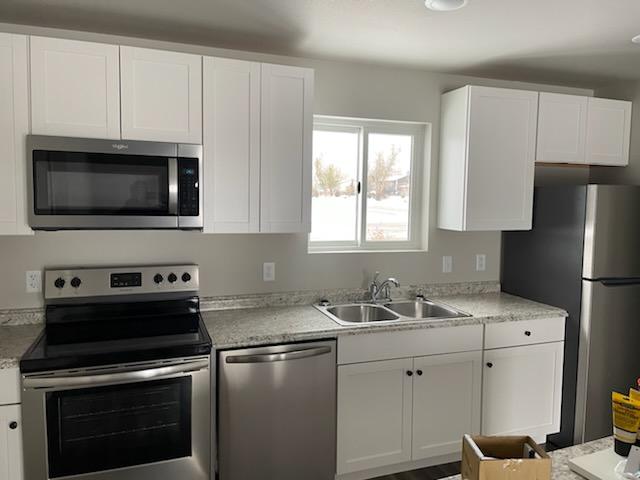 Bright, modern kitchen layout inside the Dancing Sky duplexes in Spearfish