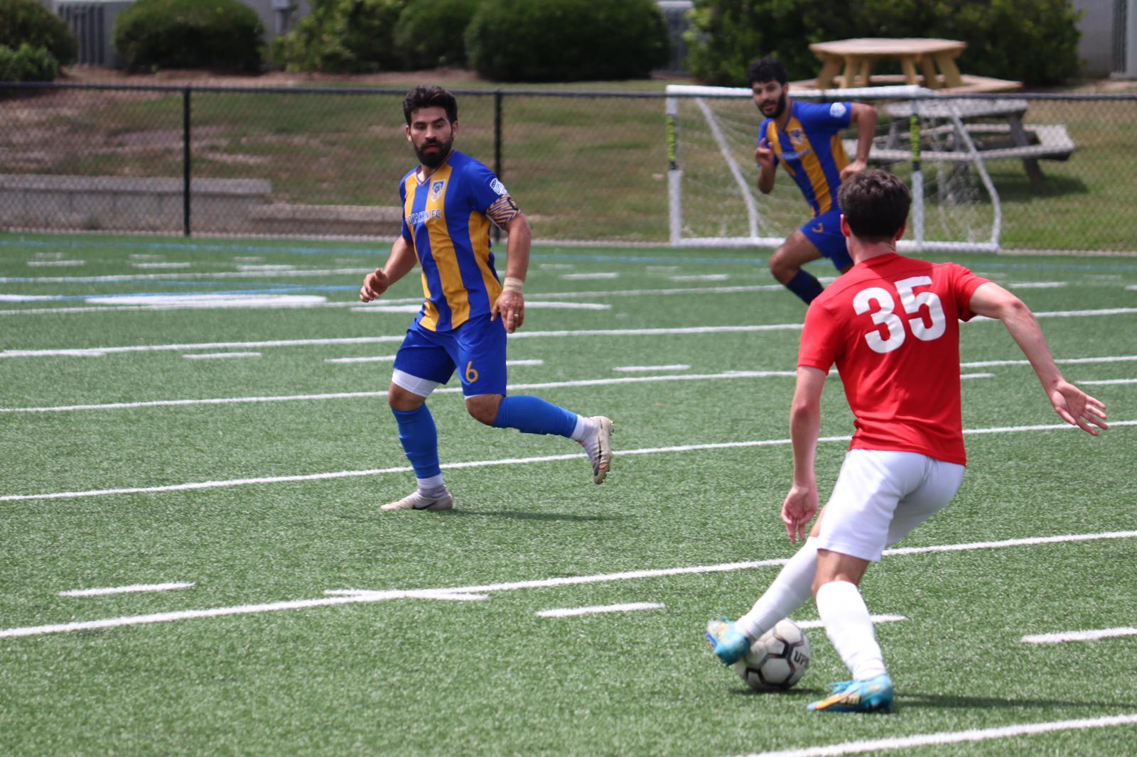College Soccer Match in Action
