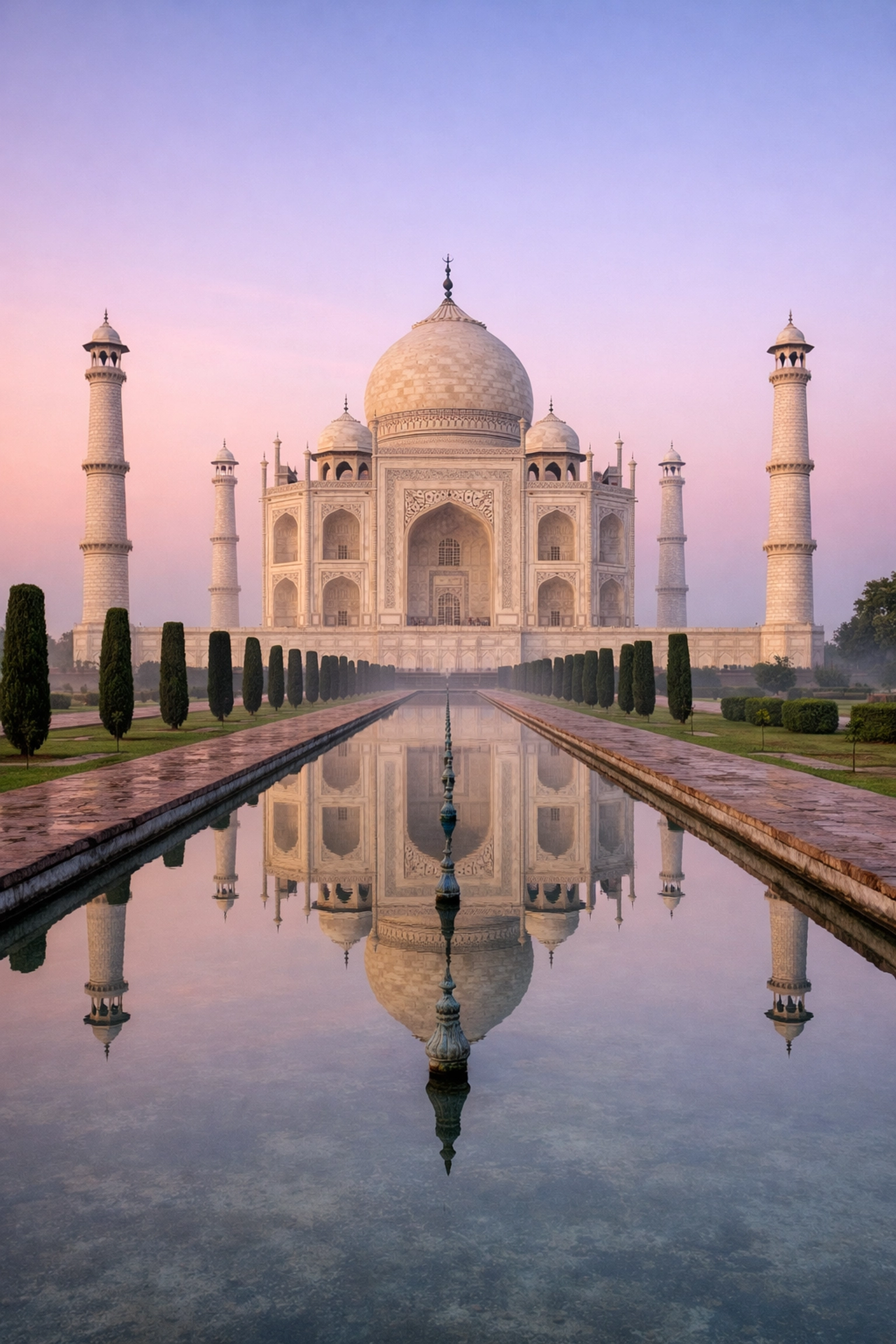 Sunrise at the Taj Mahal with reflections, one of the best photography locations in India.