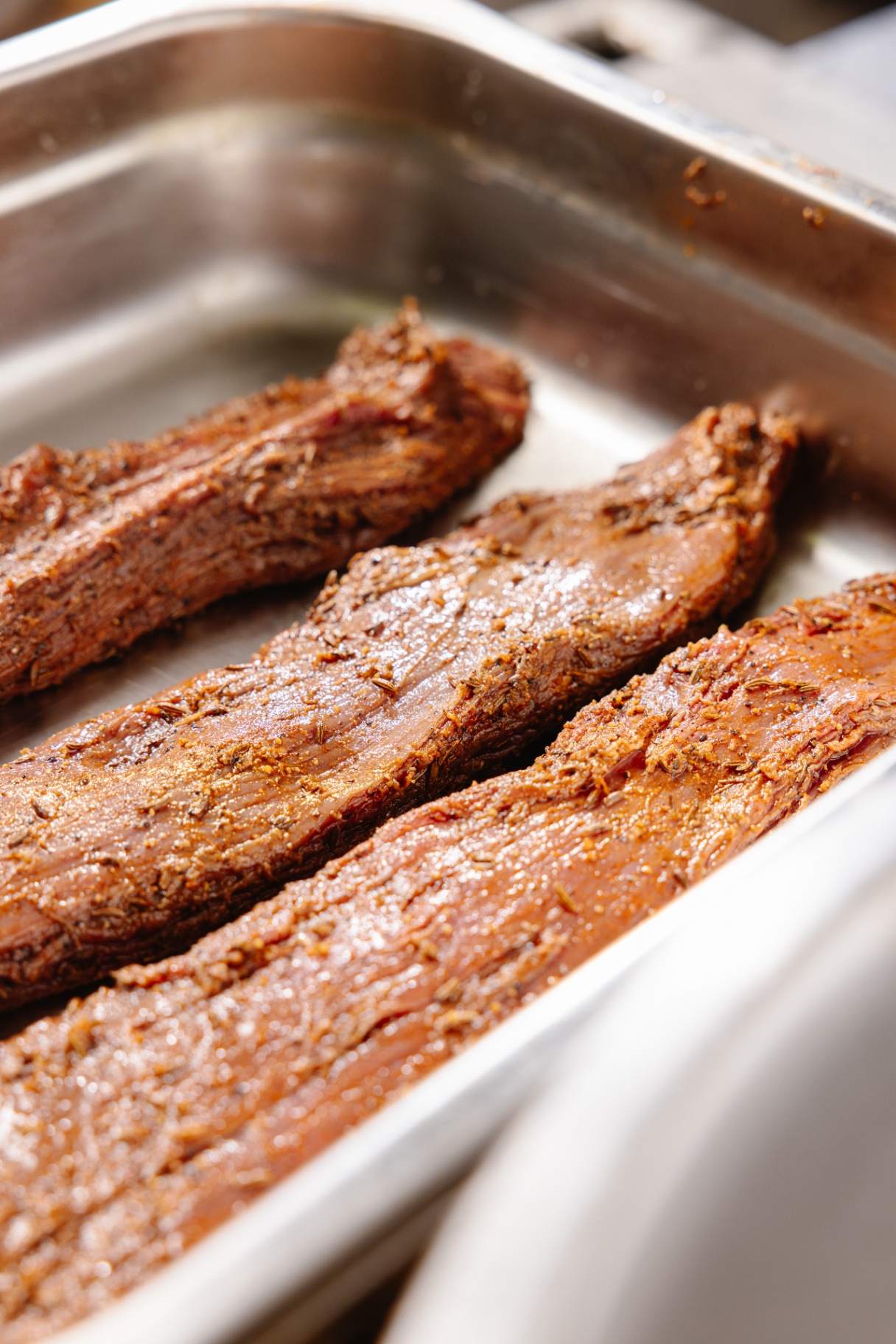 Whole marinated Australian grass fed beef slabs ready for air drying biltong process