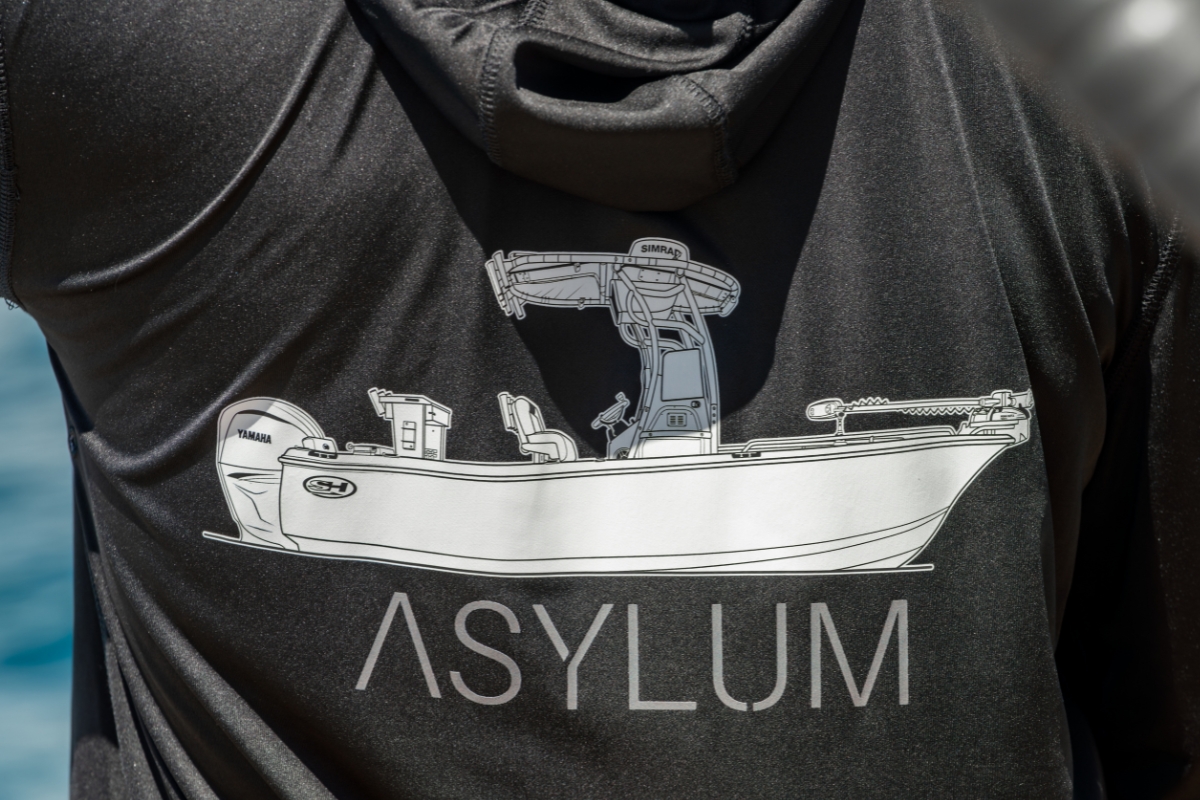 ASYLUM custom boat redraw printed on a Mkaira shirt showing crisp line detail and premium print quality