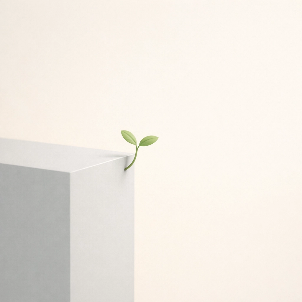 A delicate plant sprout growing from a stone block, illustrating how identity creates a competitive edge.