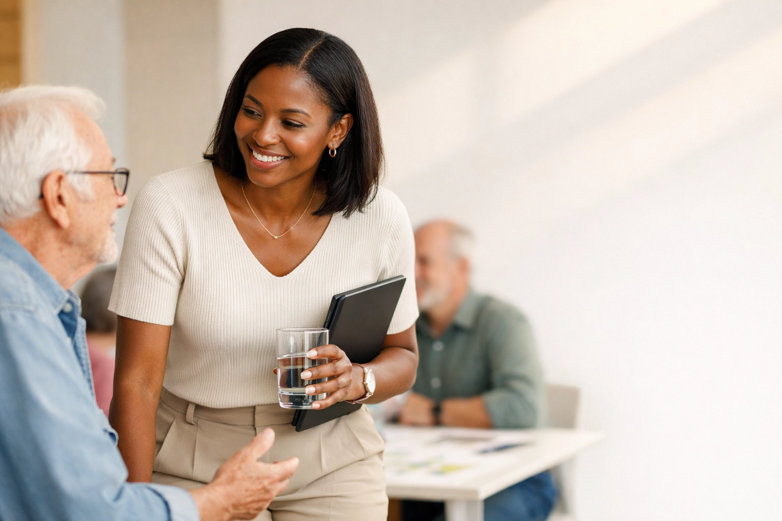 African American entrepreneur discussing long term goals for community health and wealth at a civic meeting.