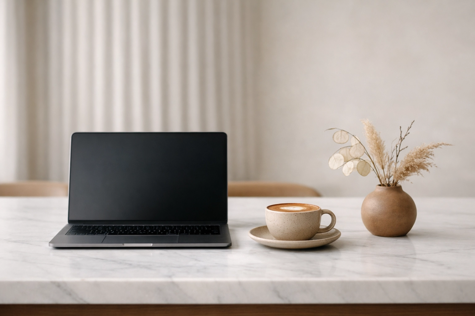 Modern laptop displaying an innovative hotel management system in a boutique hotel setting.