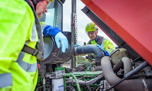 Engineers performing maintenance on heavy plant machinery