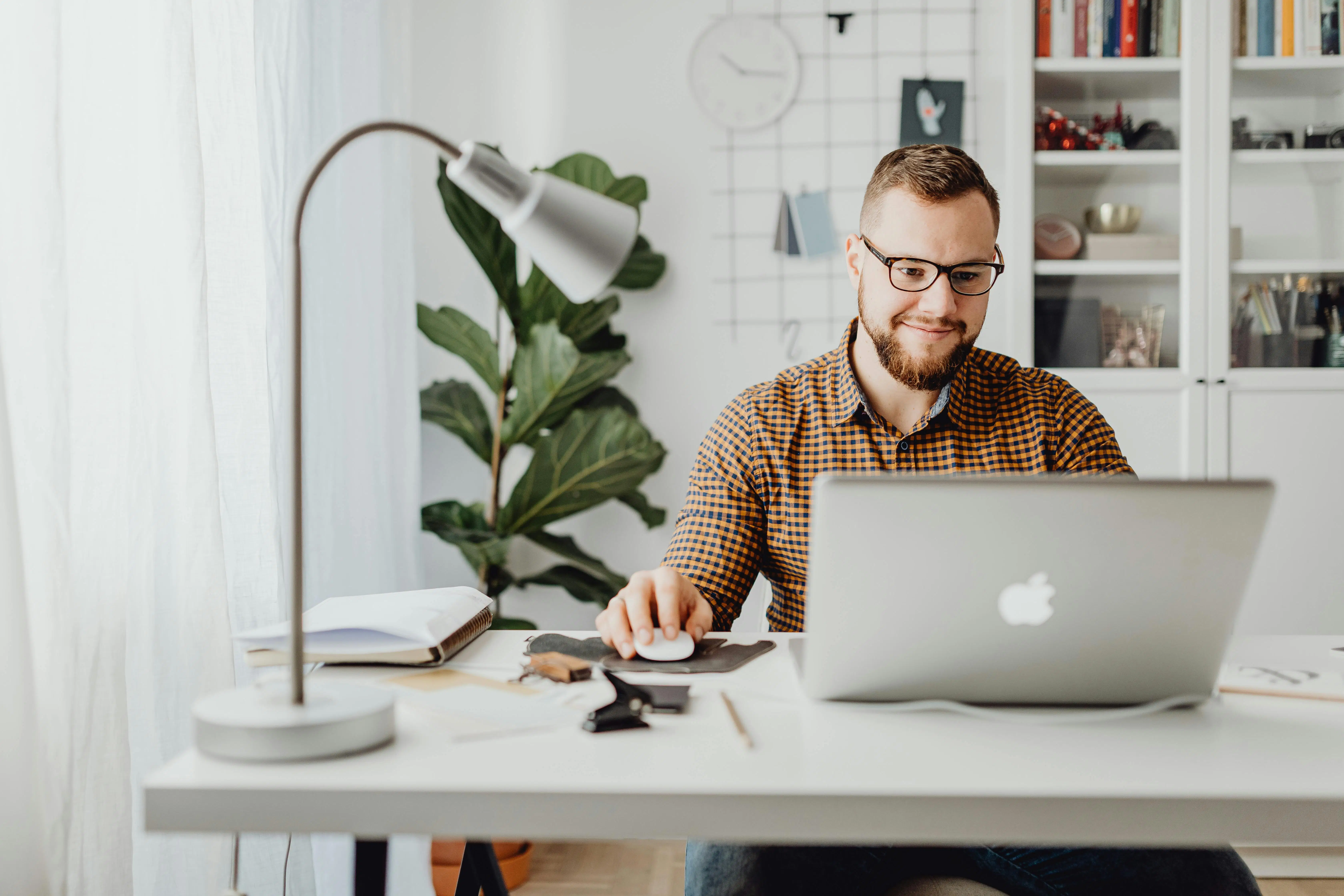 Focused small business owner working in a clean and organized office