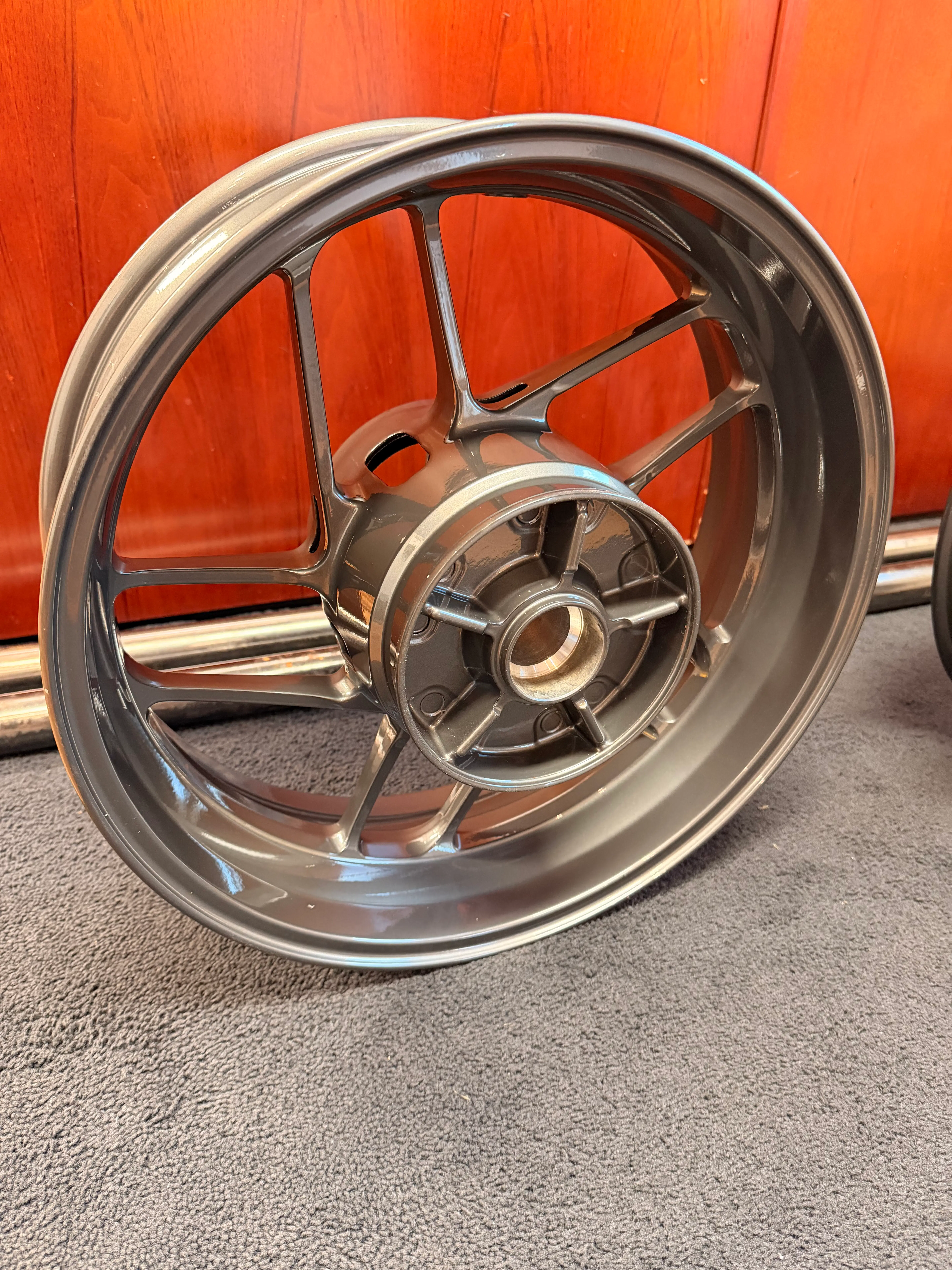 Custom powder coated motorcycle wheel in metallic graphite