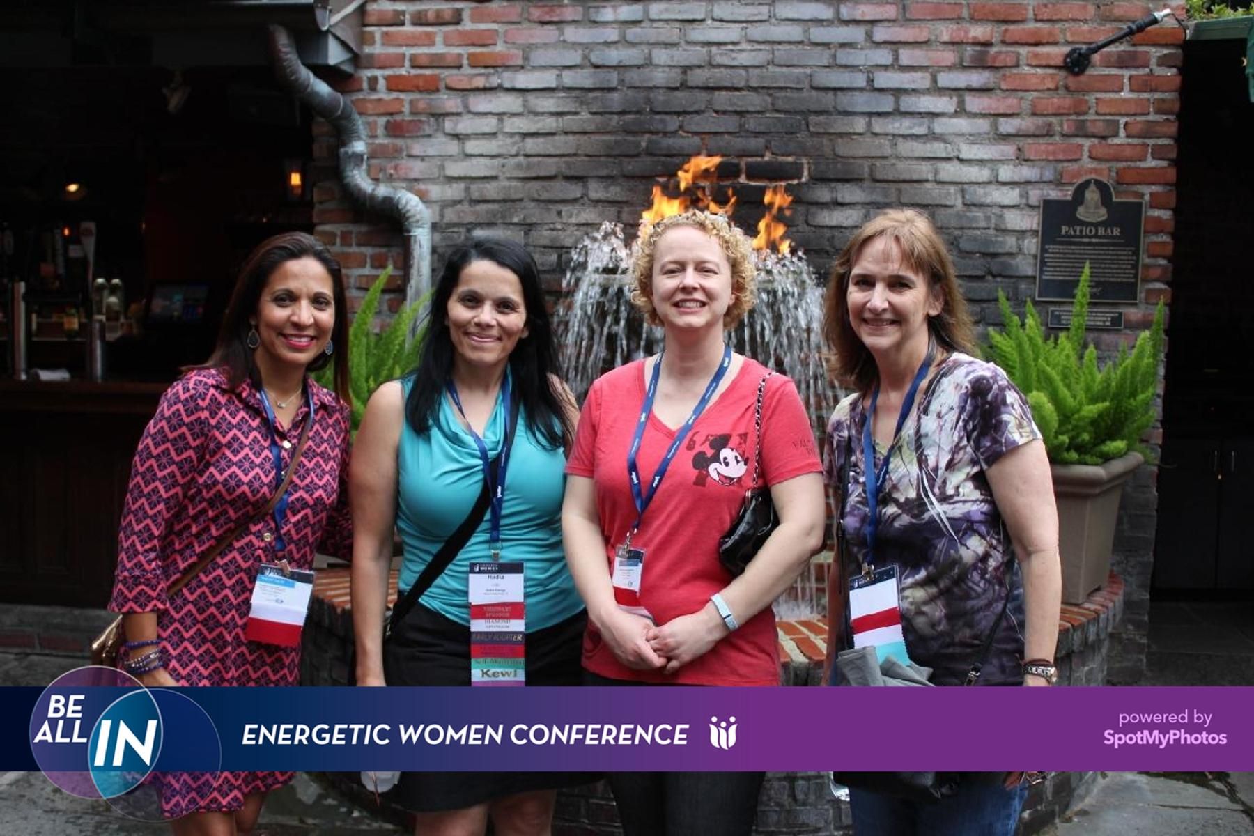 Corporate conference attendees engaging in a branded event activation, highlighting professional networking