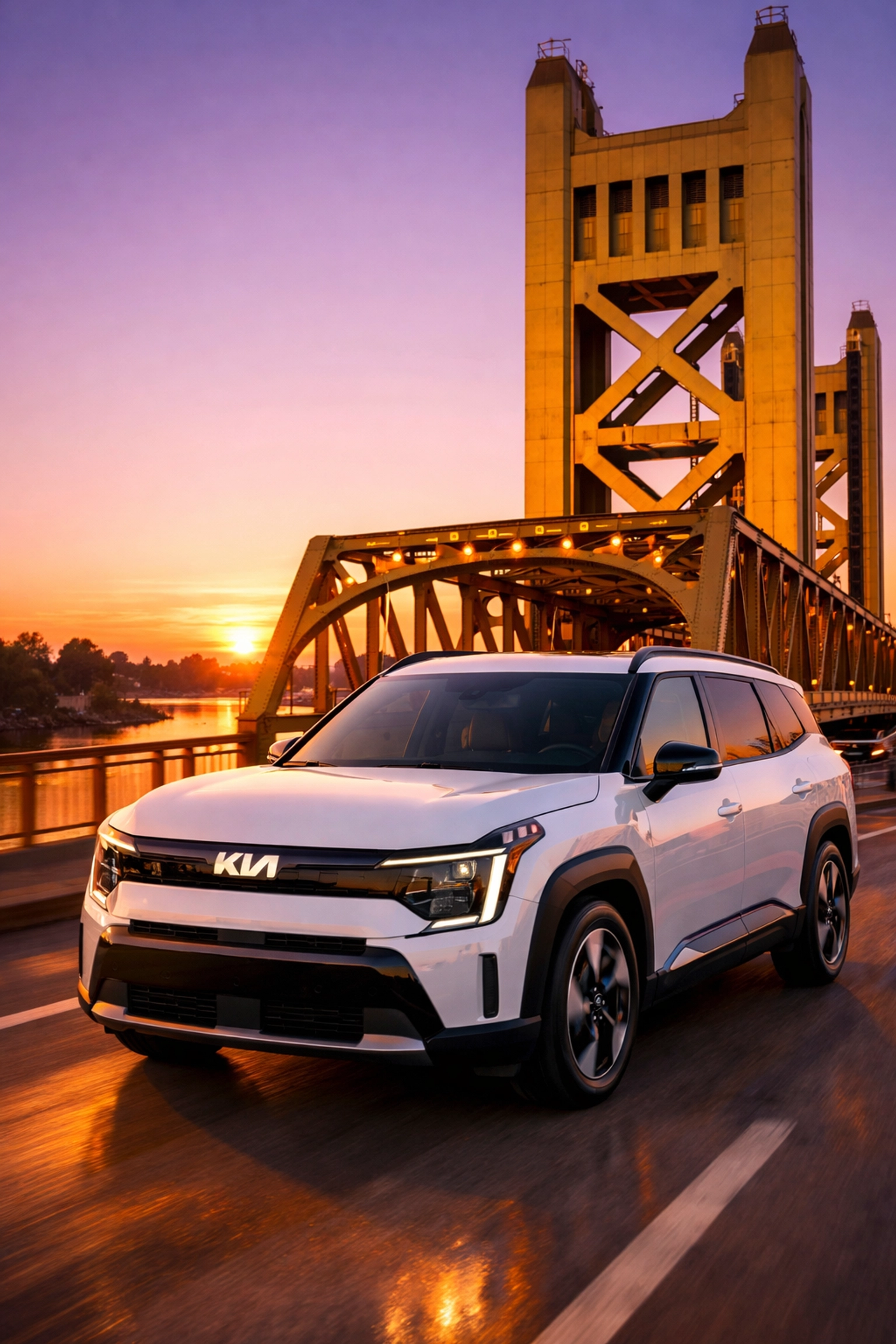 A white Kia EV9 driving across Sacramento’s Tower Bridge, highlighting electric vehicle options at local Kia dealerships.