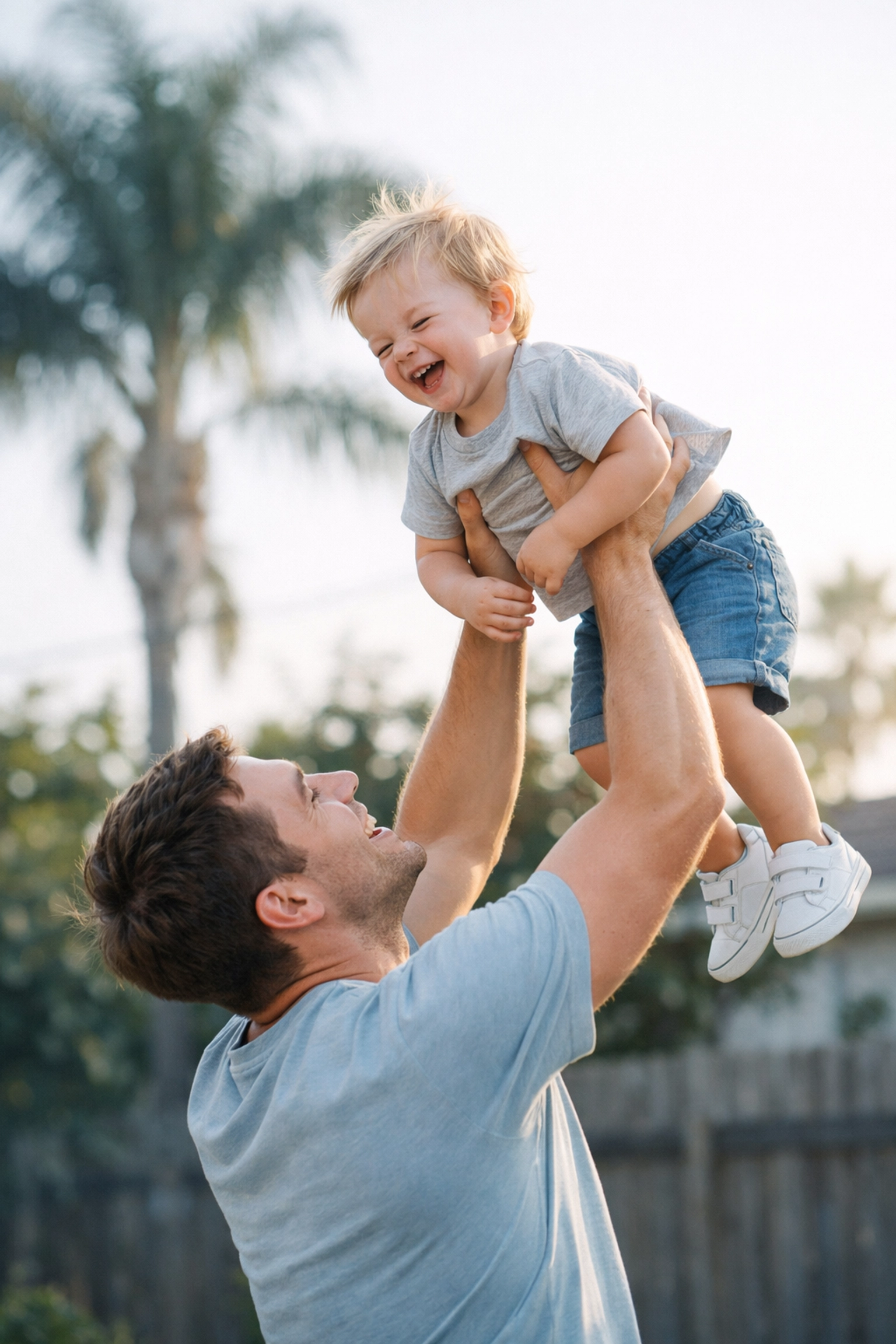 Father and child in a sunny backyard illustrating family security with term life insurance.