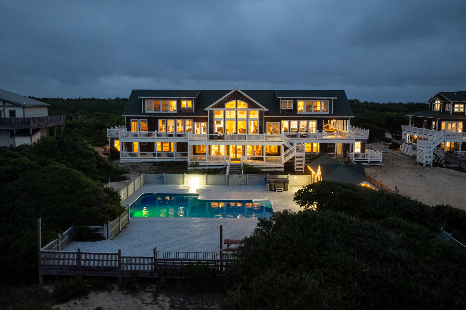 Large luxury beachfront estate at dusk Illuminated at dusk Large luxury beachfront estate at dusk Illuminated at dusk