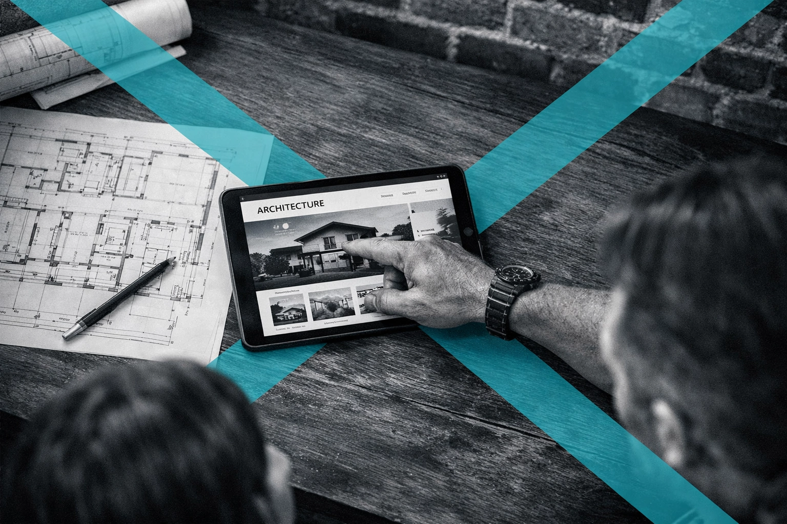 Professional remodeling website and blueprints being reviewed by a contractor and client.