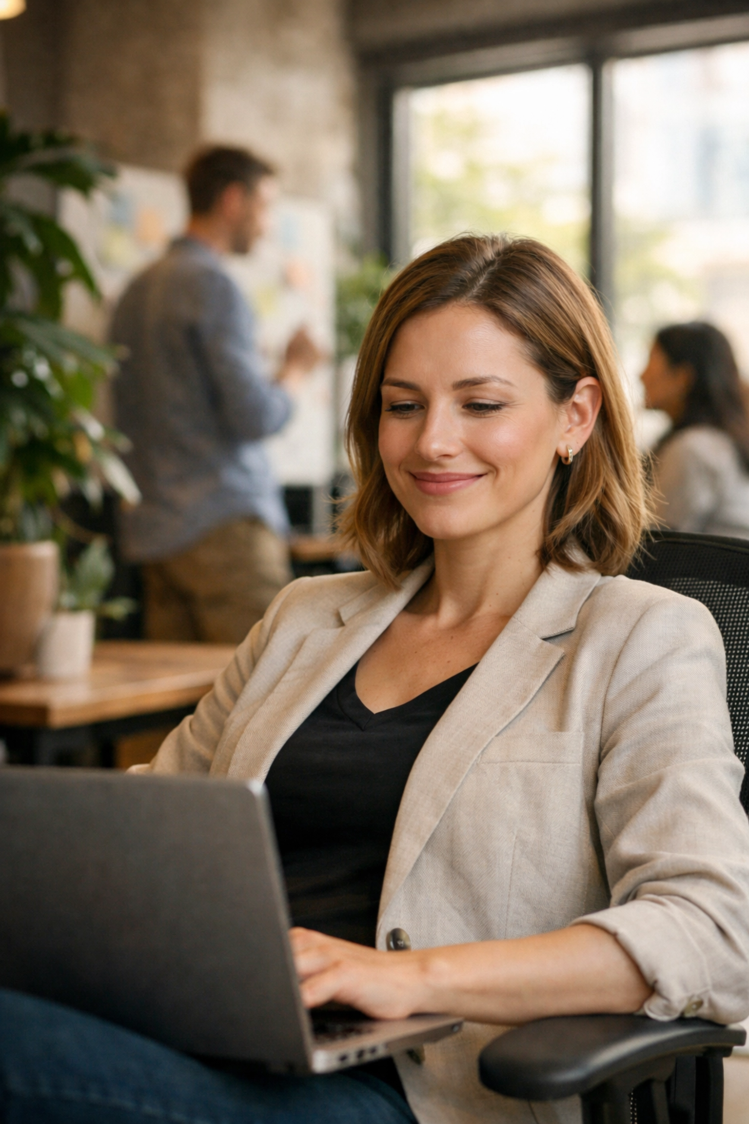 Professional using ServiceNow automation for efficient IT asset management in a modern office.