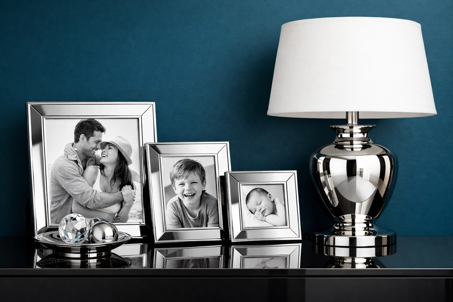 Contemporary silver accents and chrome frames against a moody jewel-toned feature wall.