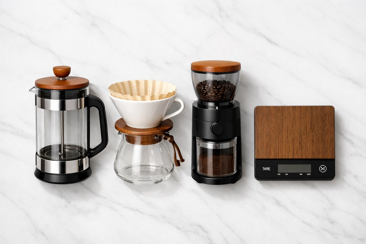 Essential home coffee brewing equipment including French press, grinder, and pour-over setup