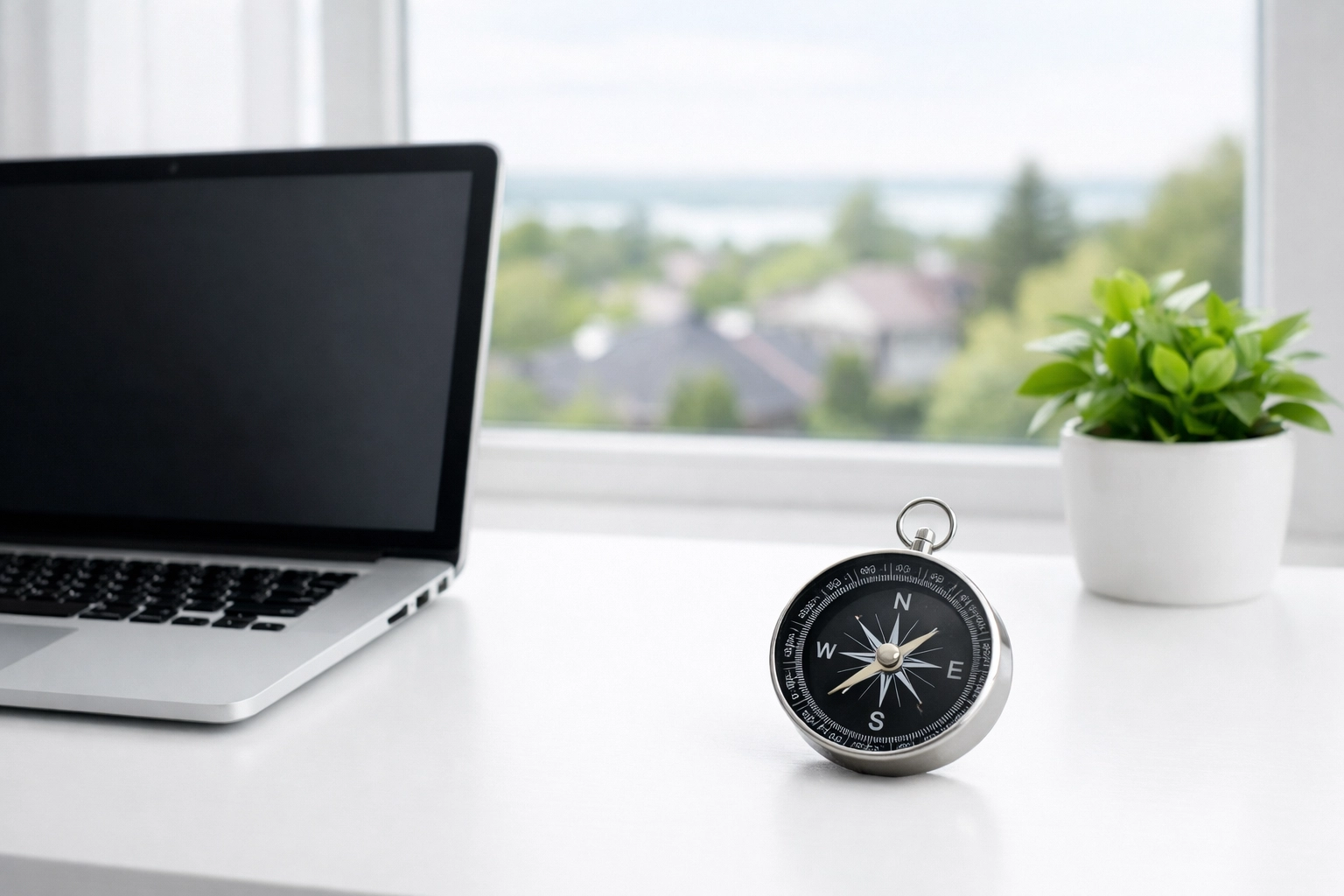 Laptop on a clean desk with a view of Innisfil, highlighting local SEO and website design services.
