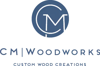 The CM Woodworks logo, featuring a circular saw blade motif with the initials CM in the center. Below, the business name is spelled out with a divider, followed by the slogan “Custom Wood Creations.”