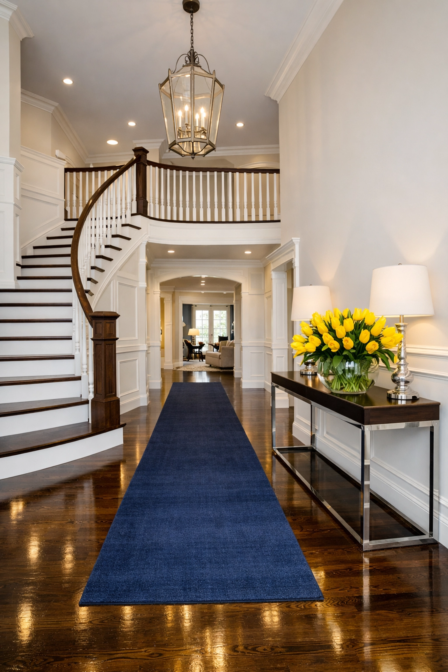 A clean, inviting luxury home entryway in Needham featuring polished hardwood floors and professional care.