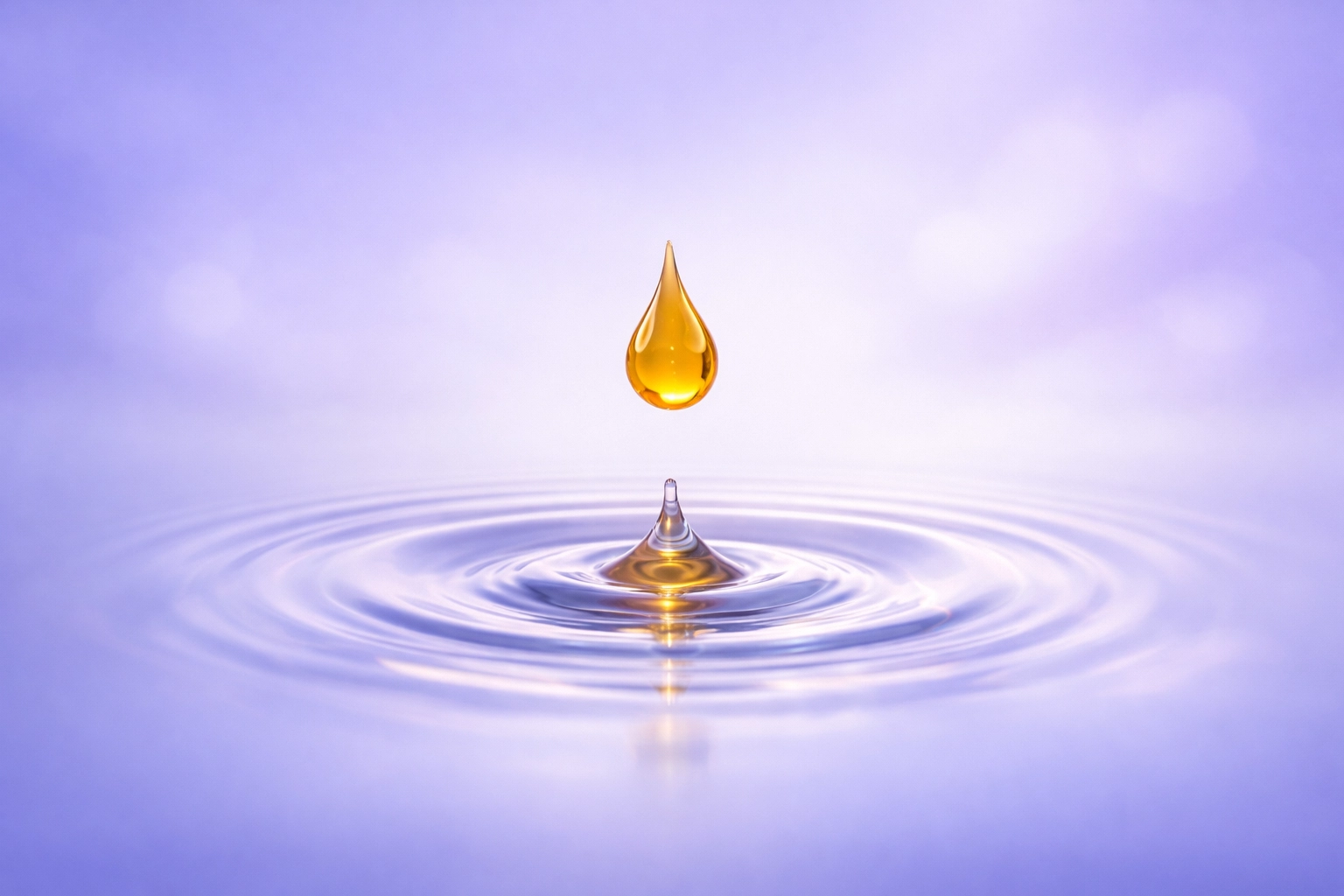 A single drop of honey creating ripples in water, symbolizing natural restoration and skin purity.