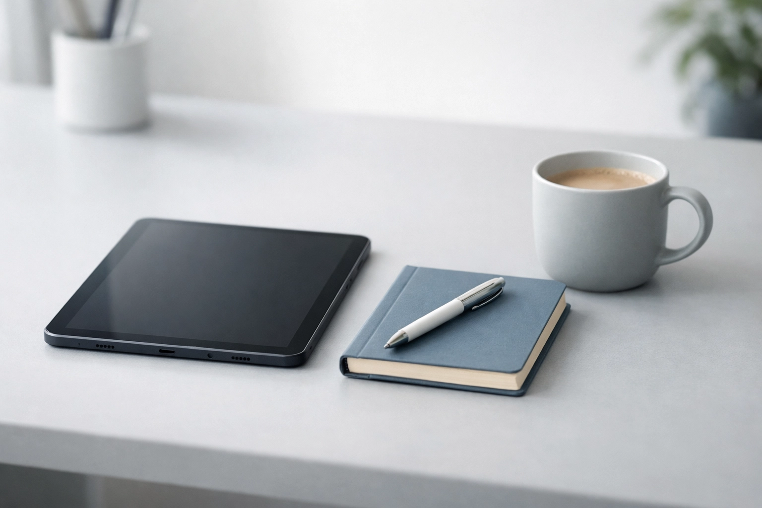 Minimalist workspace with a digital tablet and notebook balancing technical and human-centric skill development.