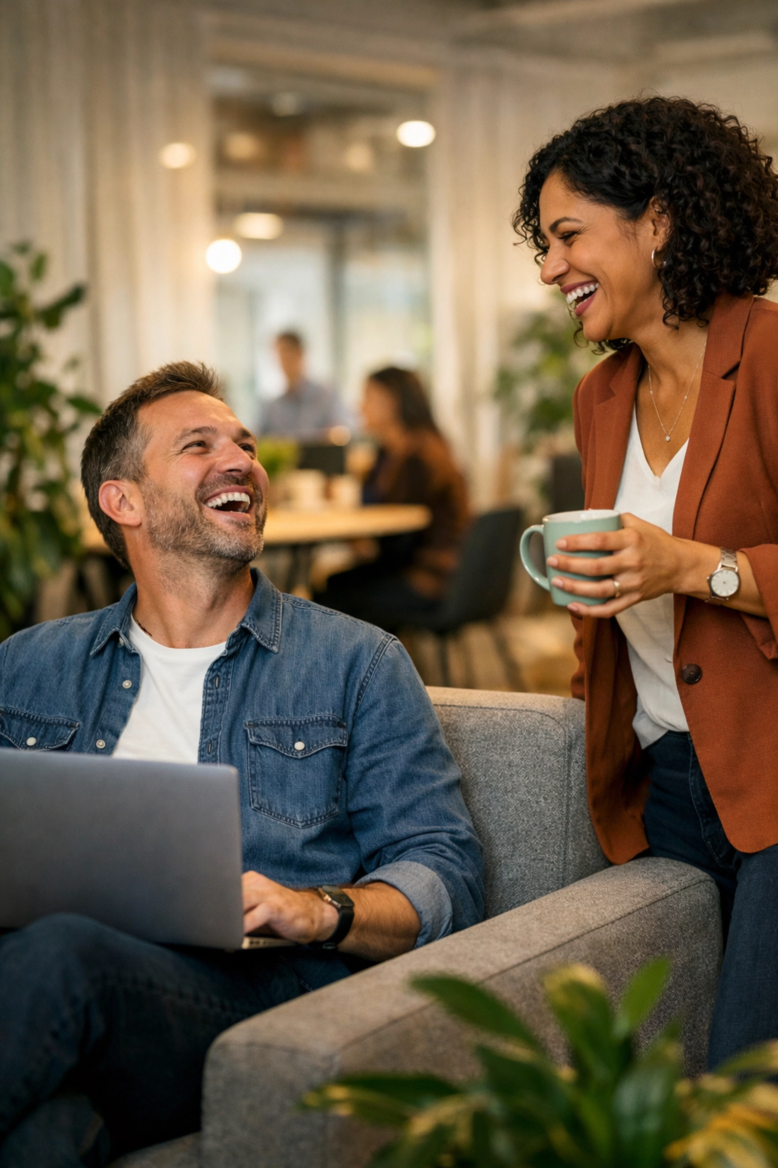 Coworkers celebrating the human impact and efficiency of a successful ServiceNow ITOM implementation.