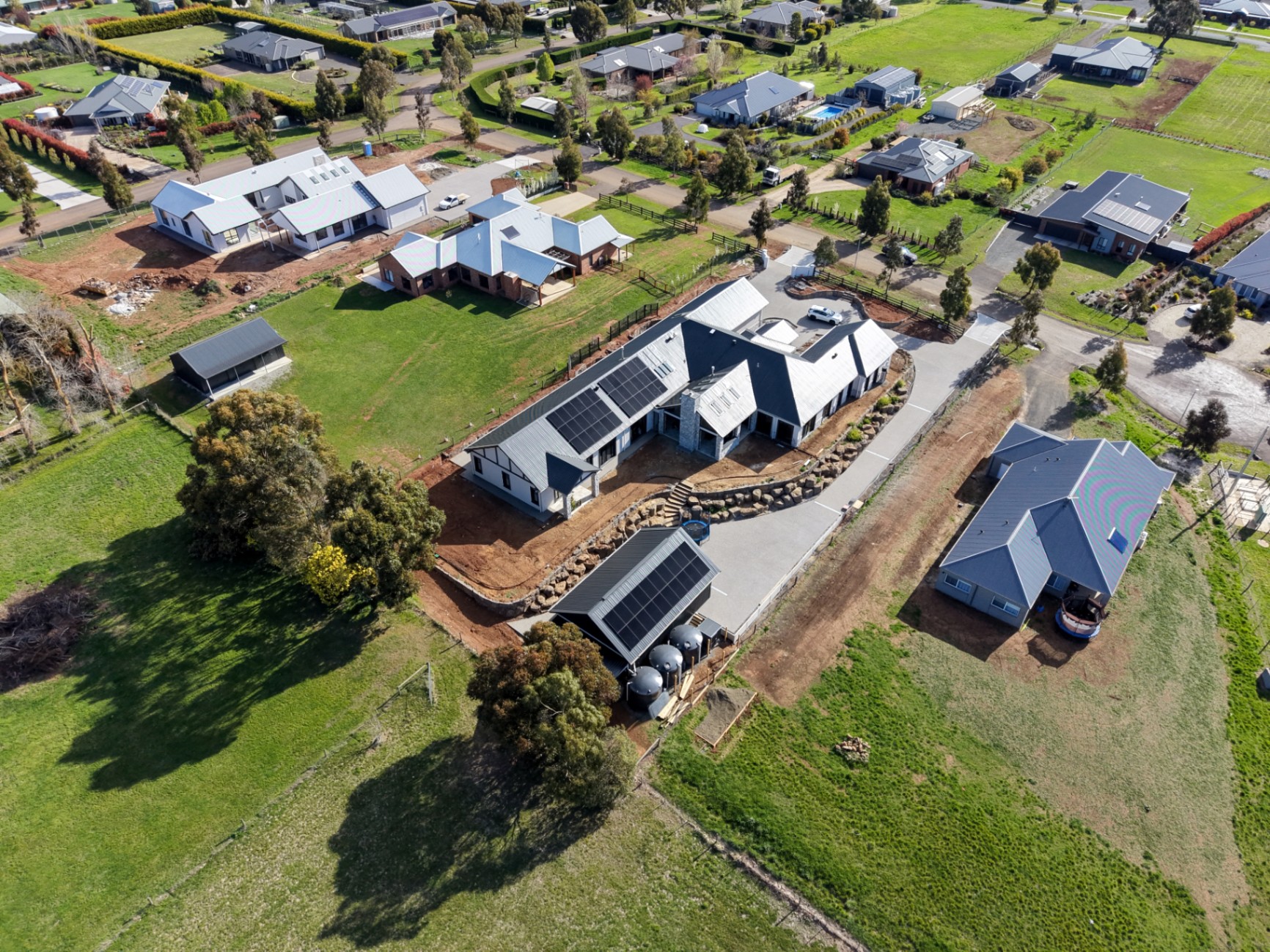 [HERO] Aerial view of rural property with solar arrays in Central Victoria