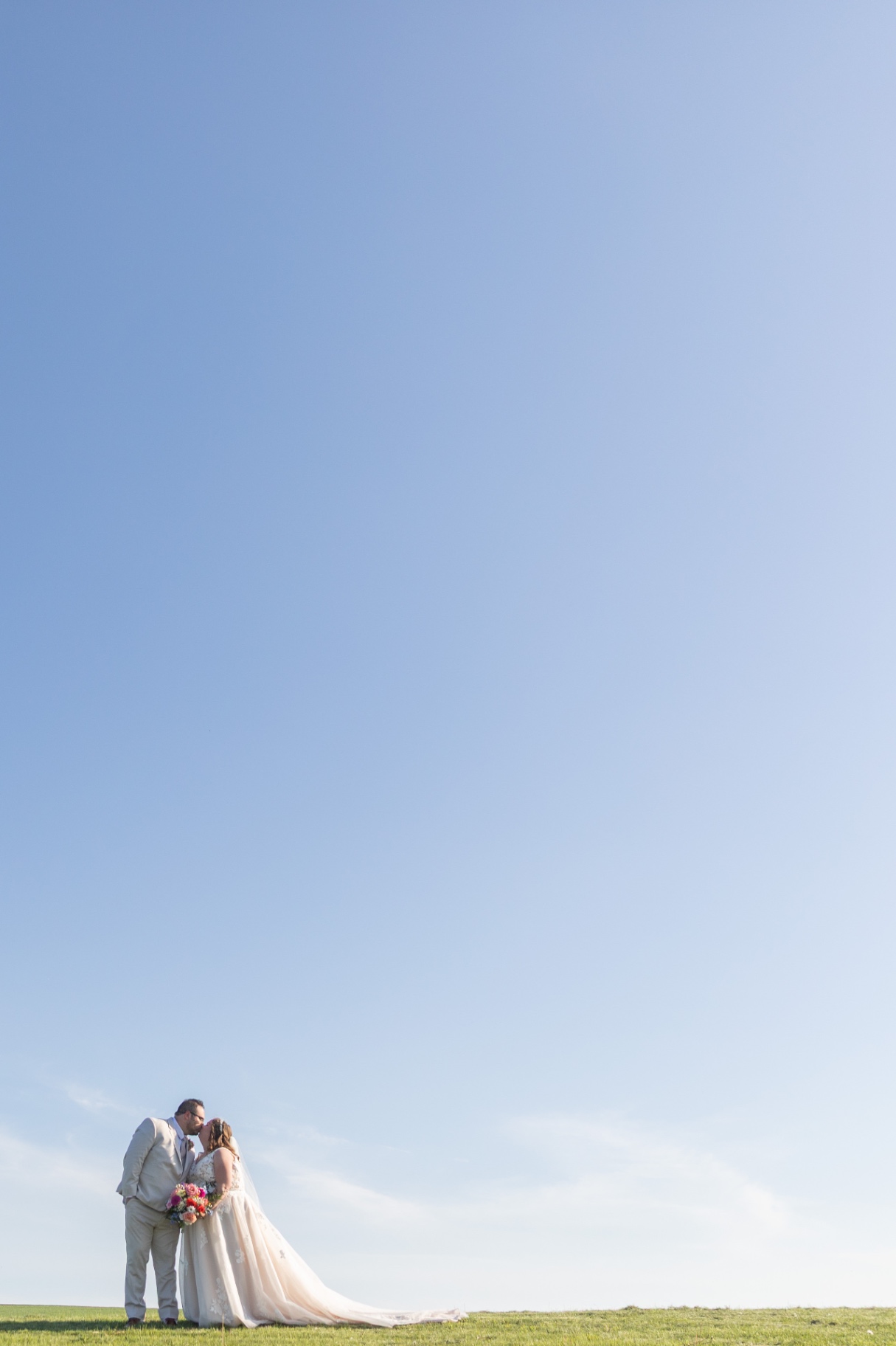 A romantic portrait of the newlyweds—soft light, open air, and that just-married glow