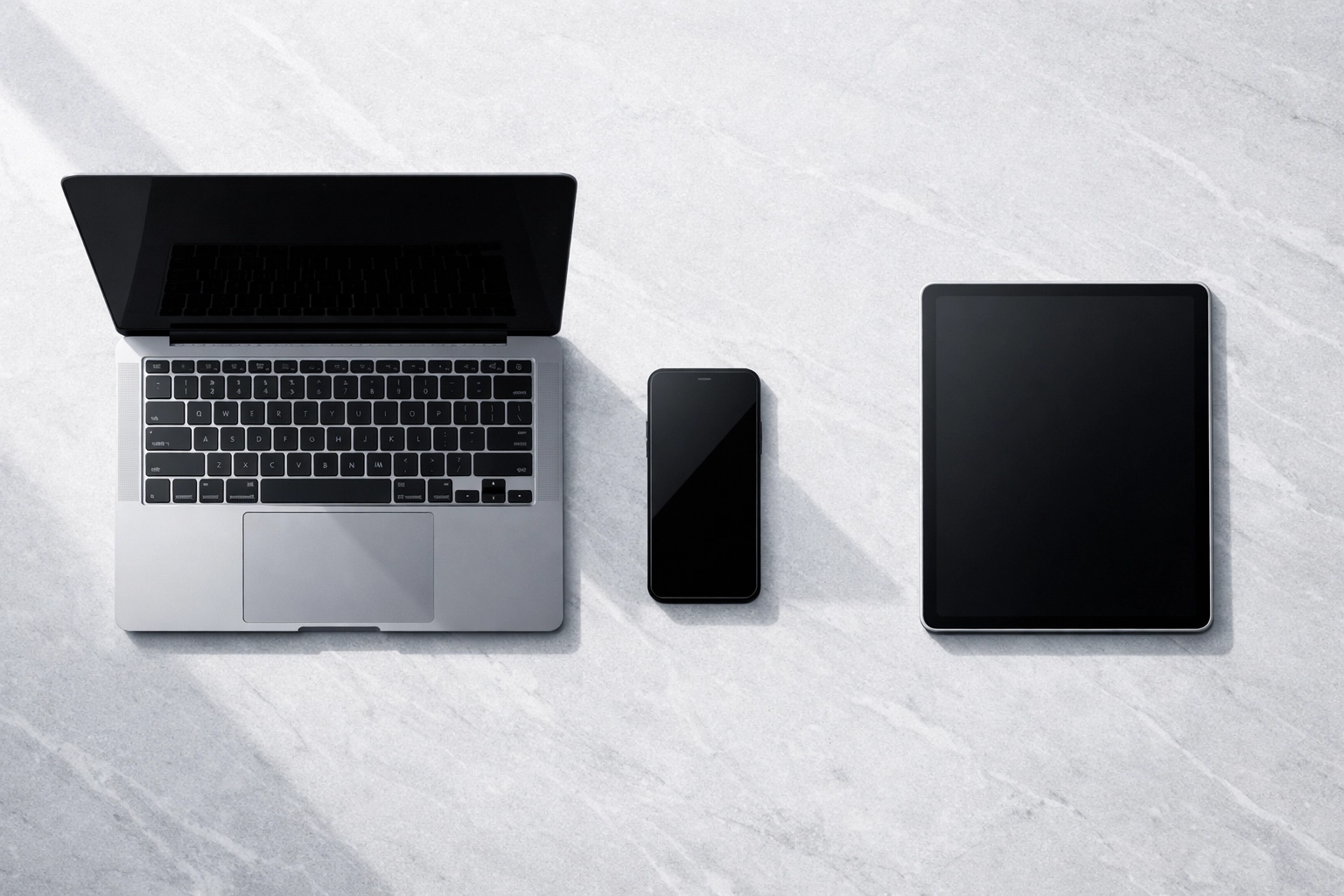 Minimalist workspace with aligned tech devices representing a strategic brand audit for clarity