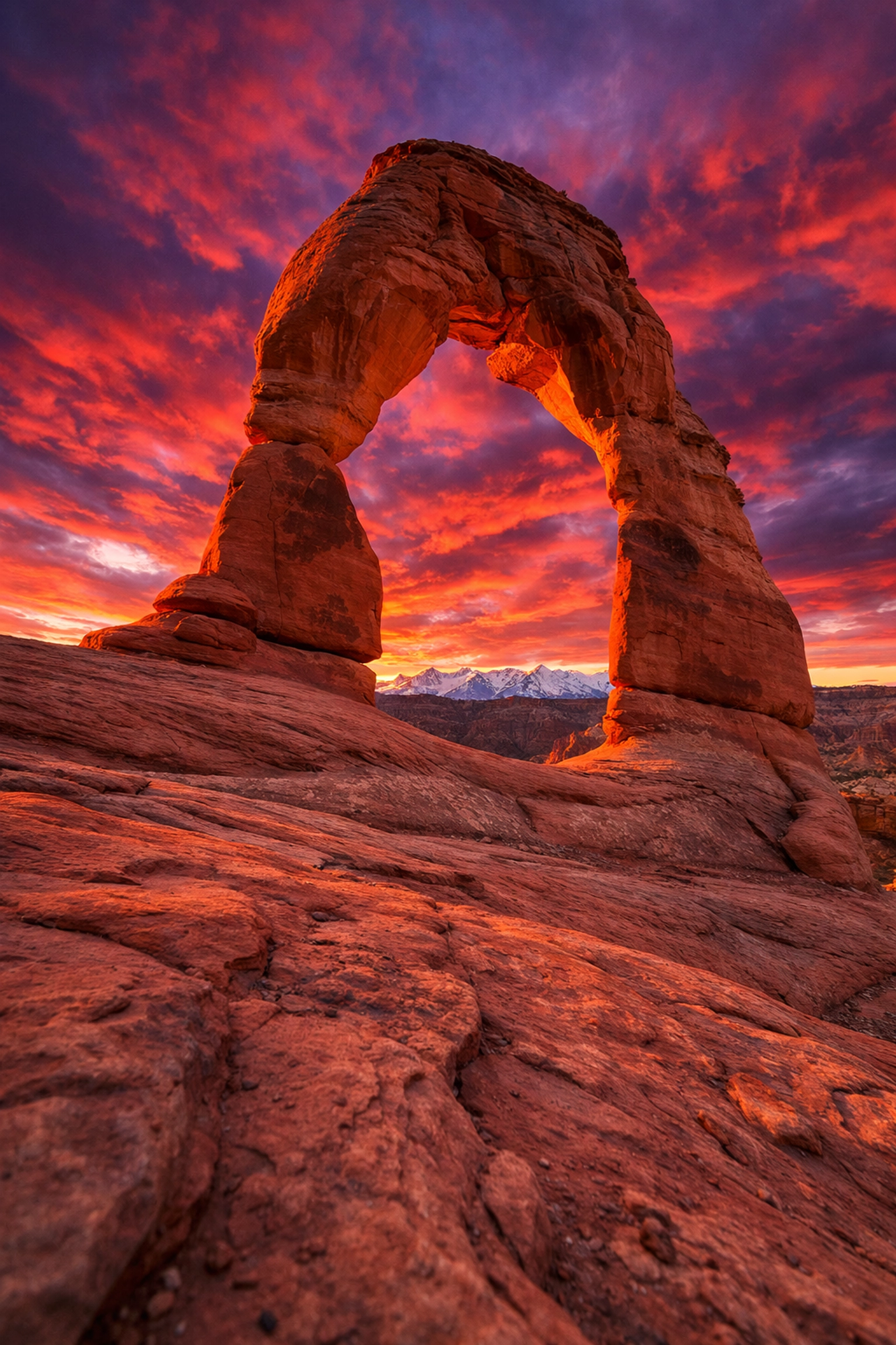 Sunset at Delicate Arch in Arches National Park, one of the best landscape photography locations.