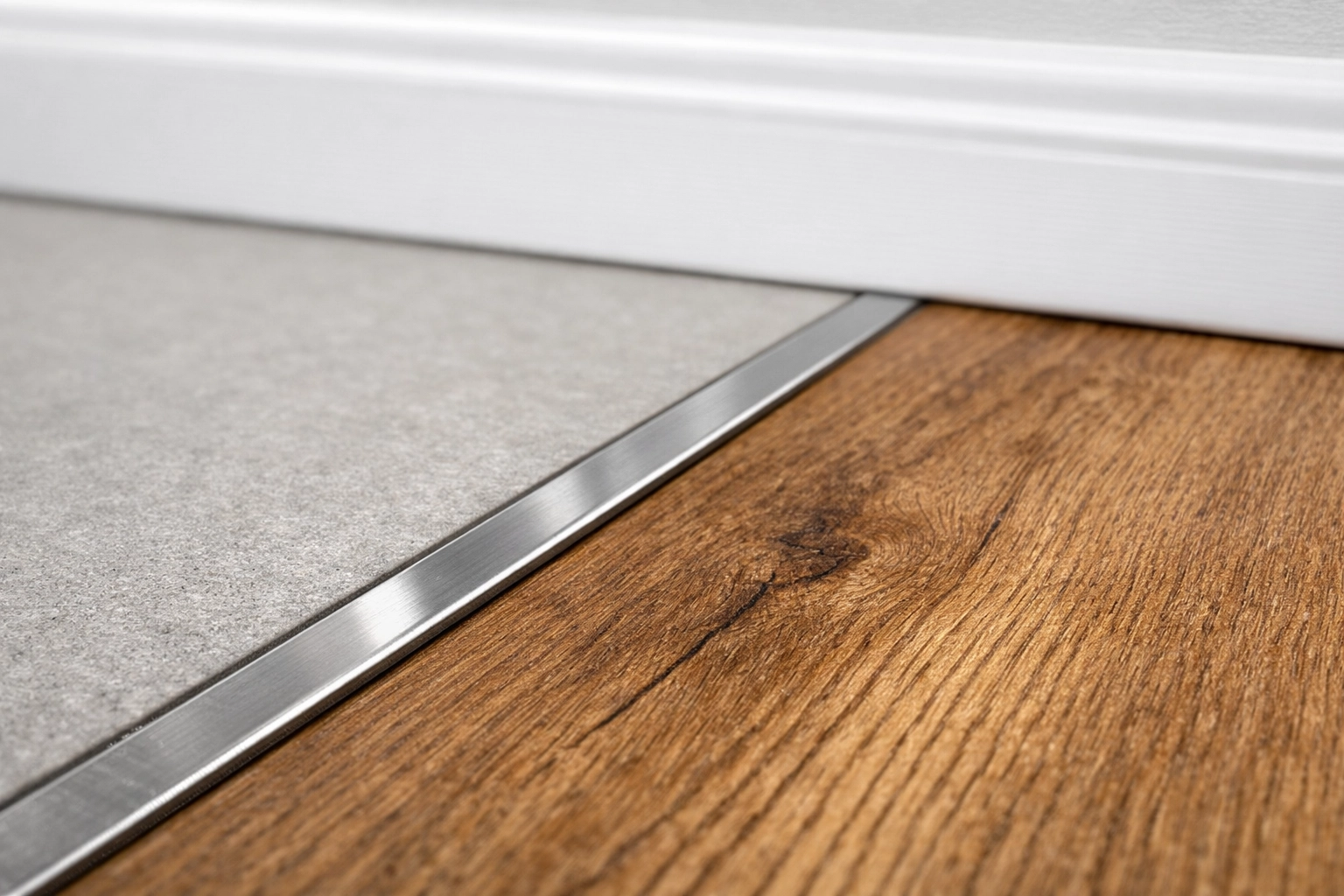 Close-up of seamless tile and wood flooring transitions showing expert craftsmanship in an Orlando renovation.