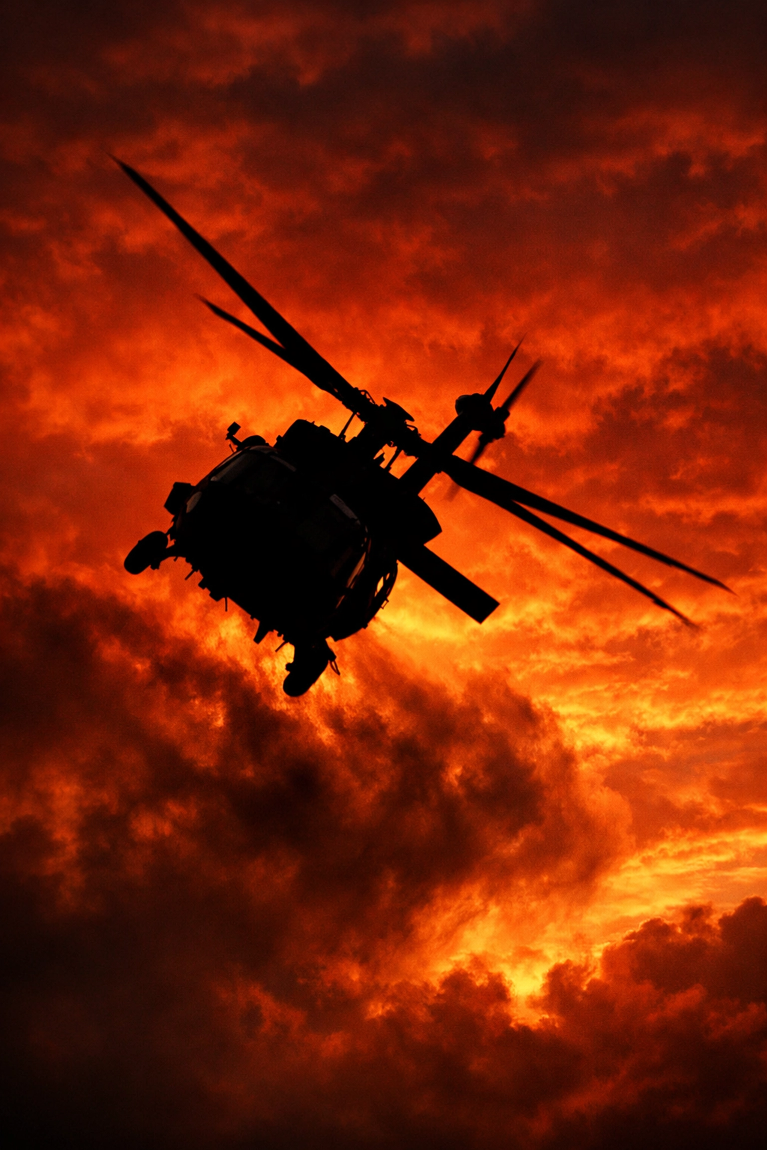Helicopter silhouette banking at sunset symbolizing the calculated risks of aviation professionals