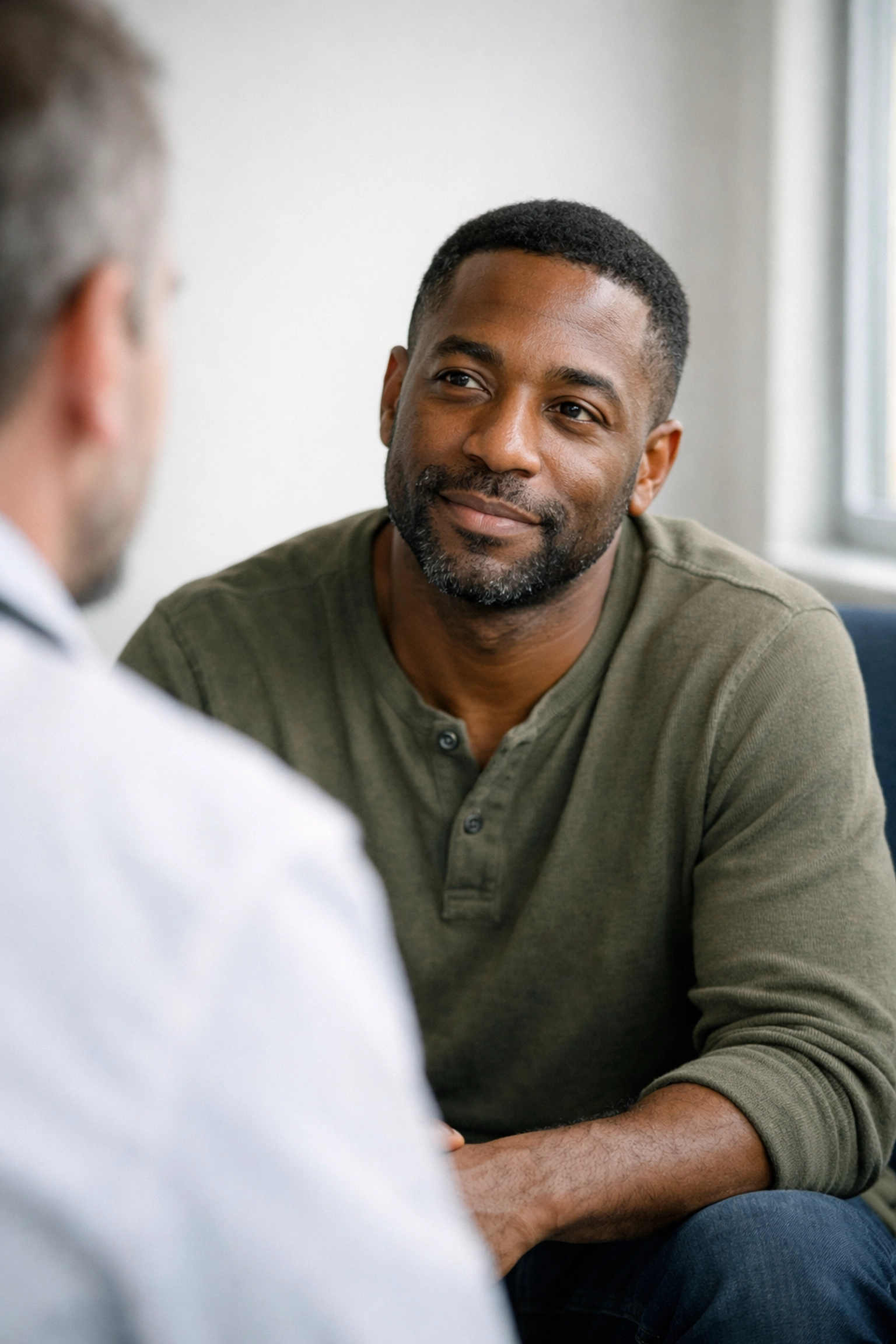 Patient in consultation discussing chronic fatigue symptoms with consultant physician