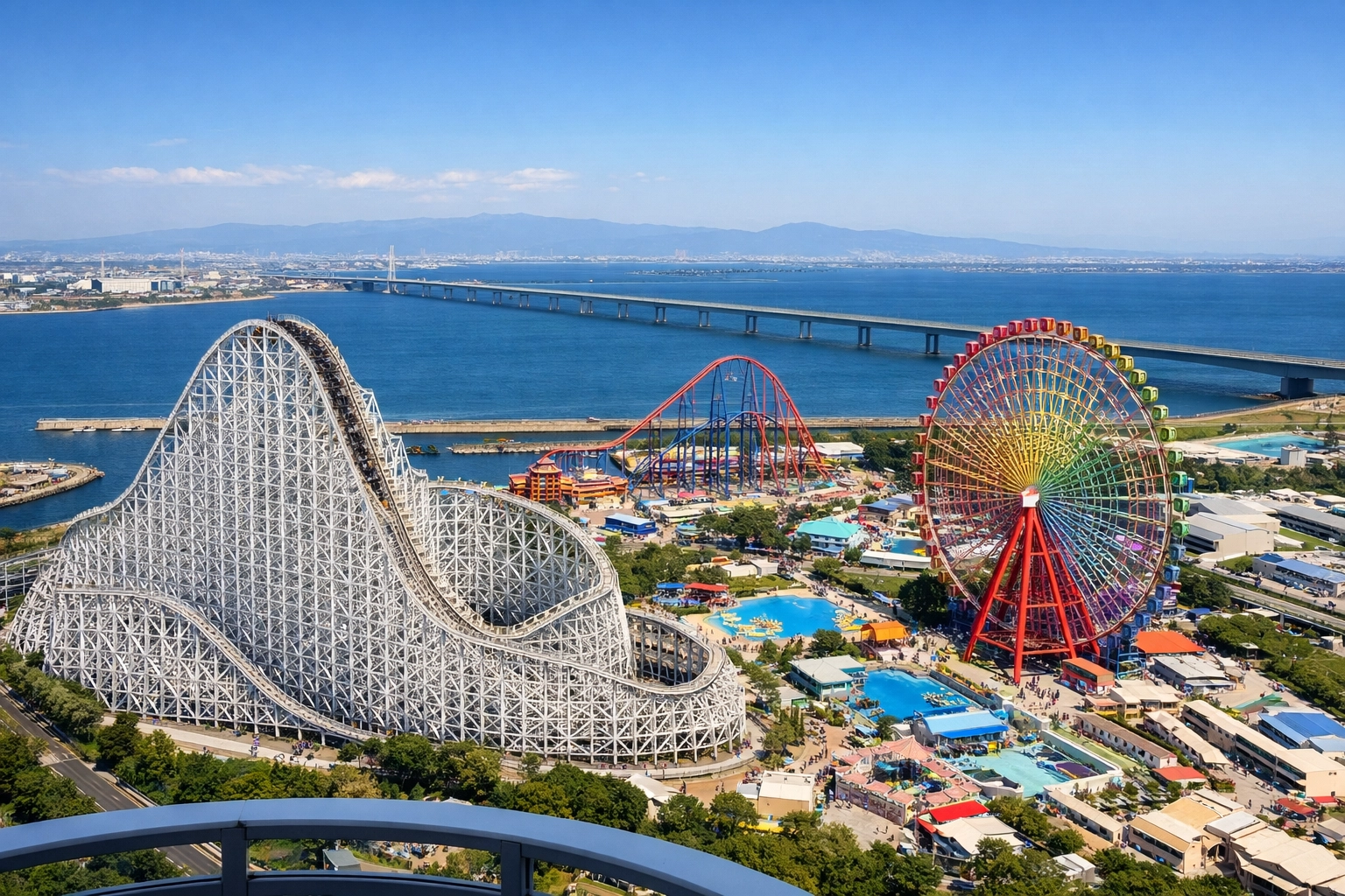 Wide-angle view of Nagashima Spa Land from a high point, highlighting top photo spots like Hakugei and the Aurora Wheel.