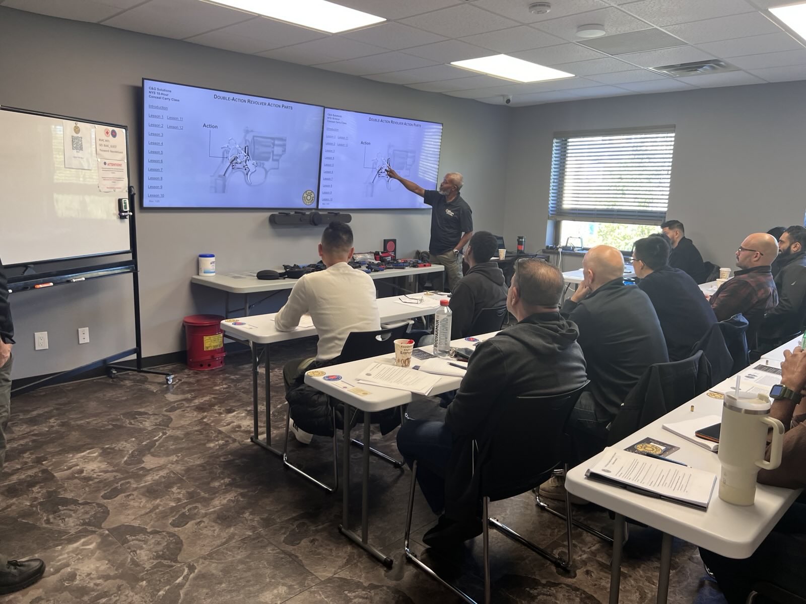 Instructor leading a classroom session on firearms safety in Oceanside