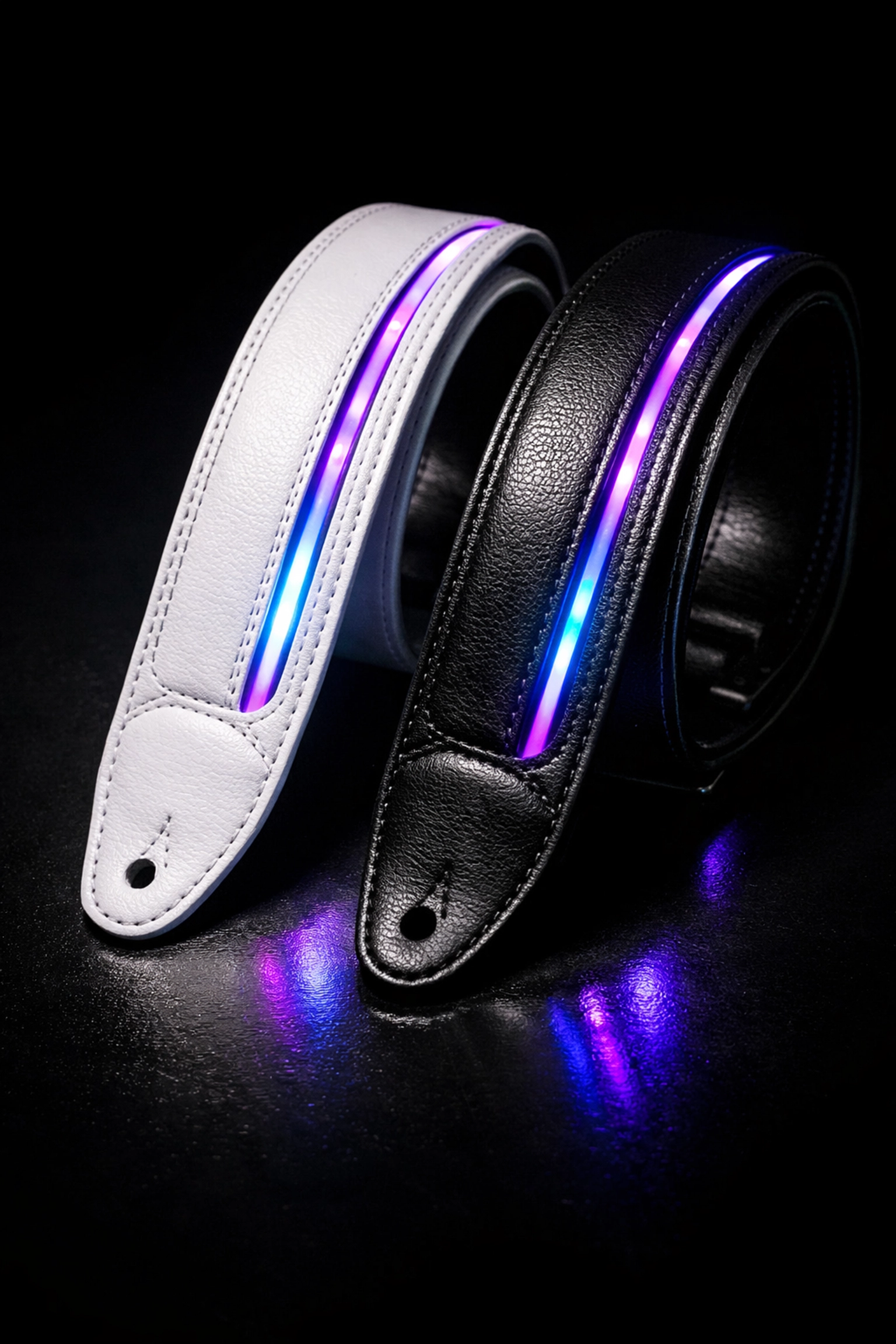 White and black leather guitar straps with glowing purple and blue LED lights side by side