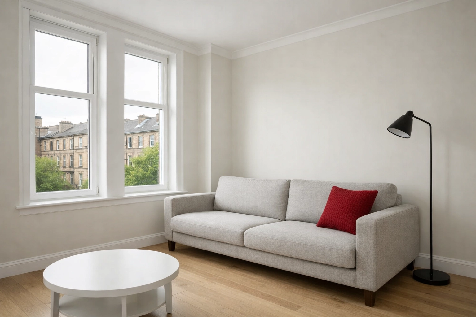 Staged modern Glasgow living room with neutral walls and natural light to improve house valuation.