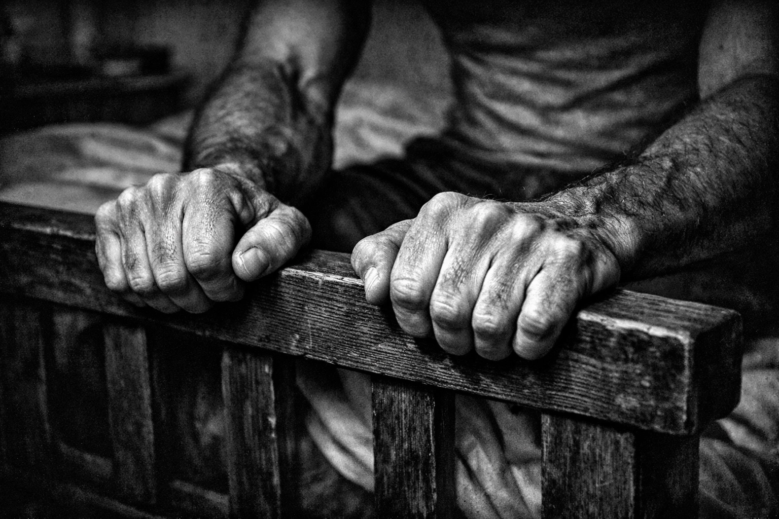 Hands demonstrating tension and control during pelvic floor muscle exercises for men