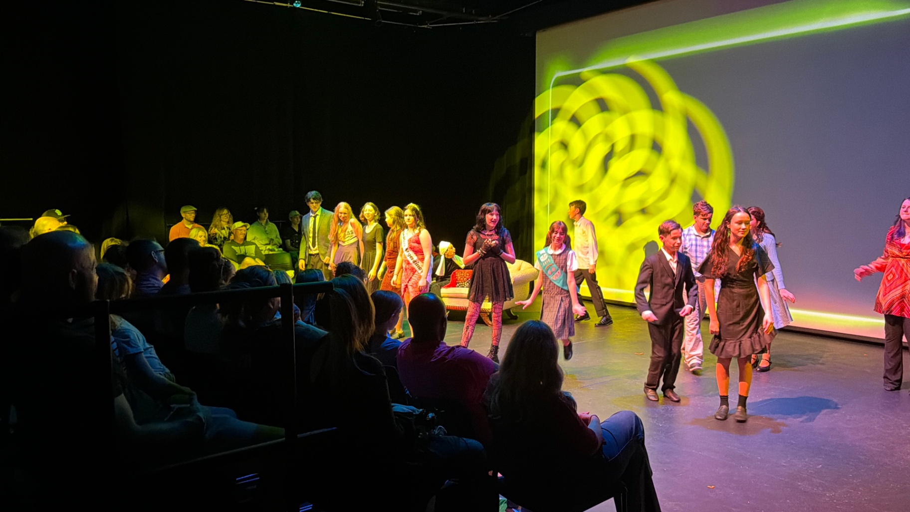 Rockwall Acting Performance A group of young actors in costume perform on stage under professional lighting