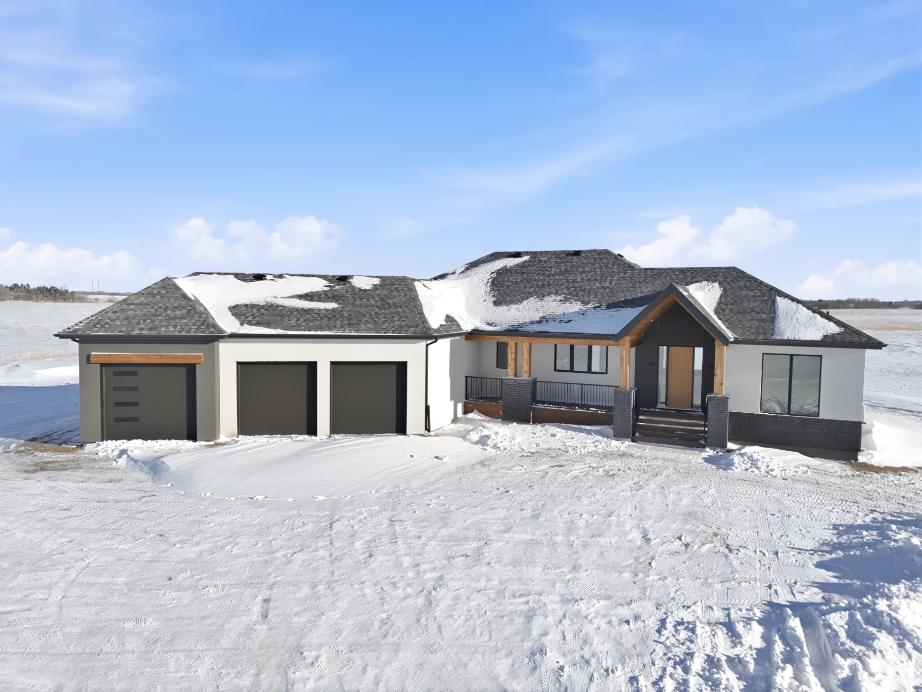 Aerial exterior photo of modern bungalow-style home