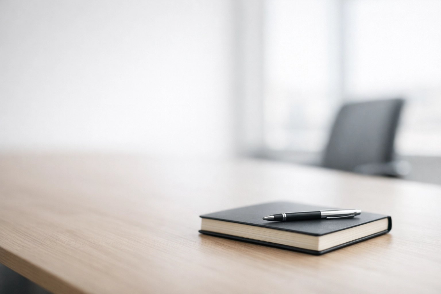 Prepared conference room with notebook ready for executive meeting brief